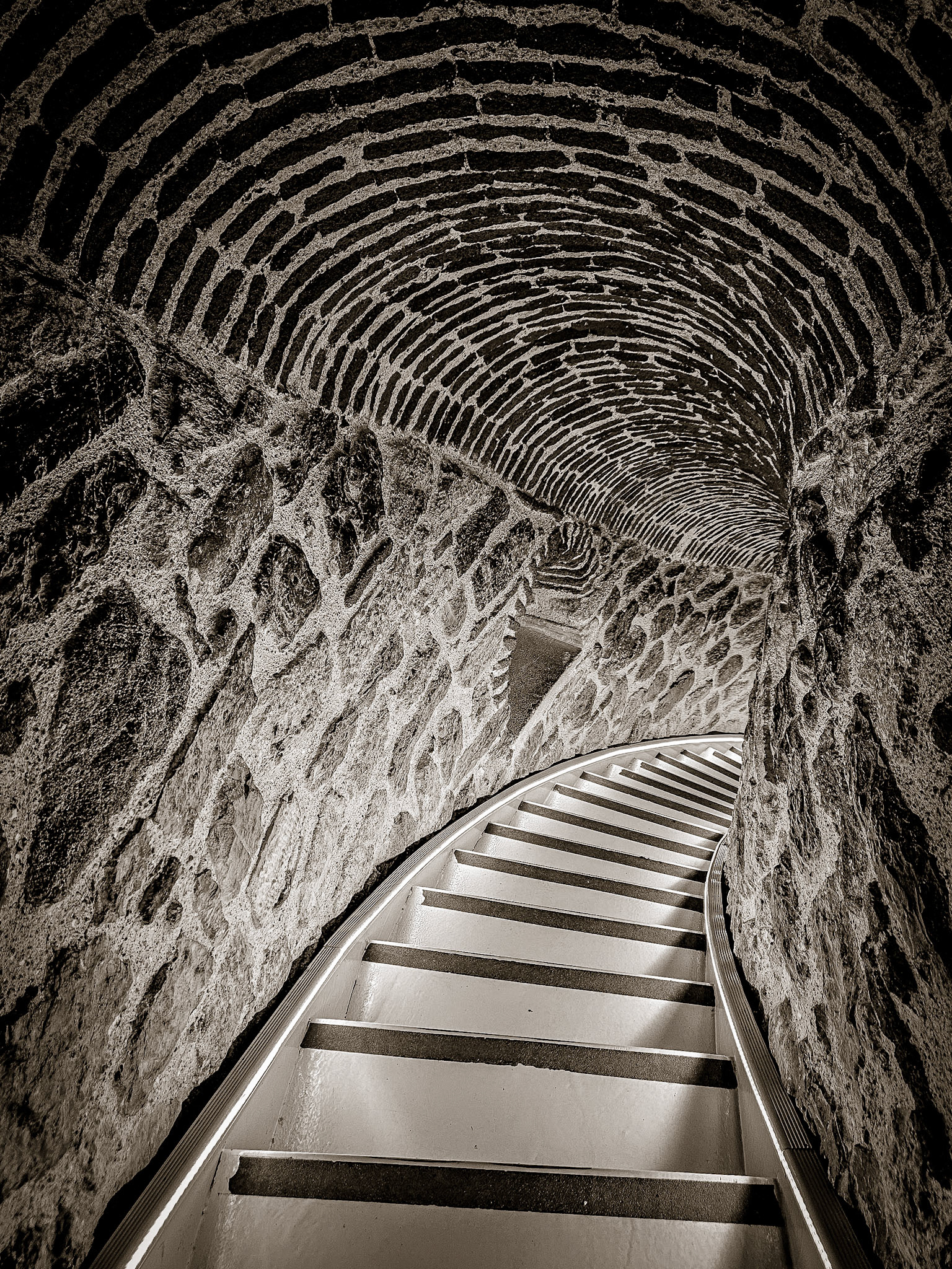 A steep clostrophobic staircase curls around the Galata Tower in the ancient city of Istanbul