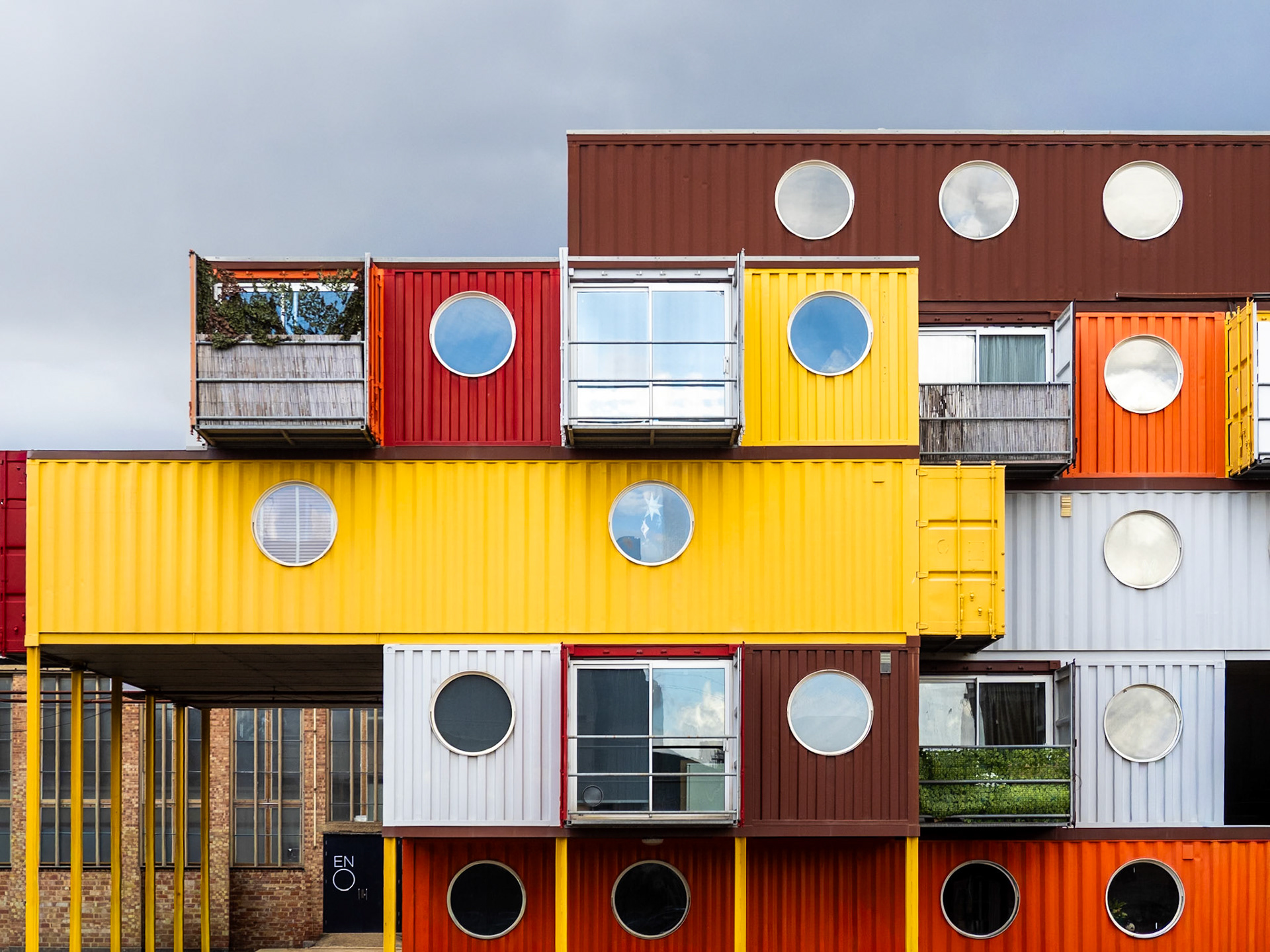 Colourful contrainers form a block of flats in London's East End