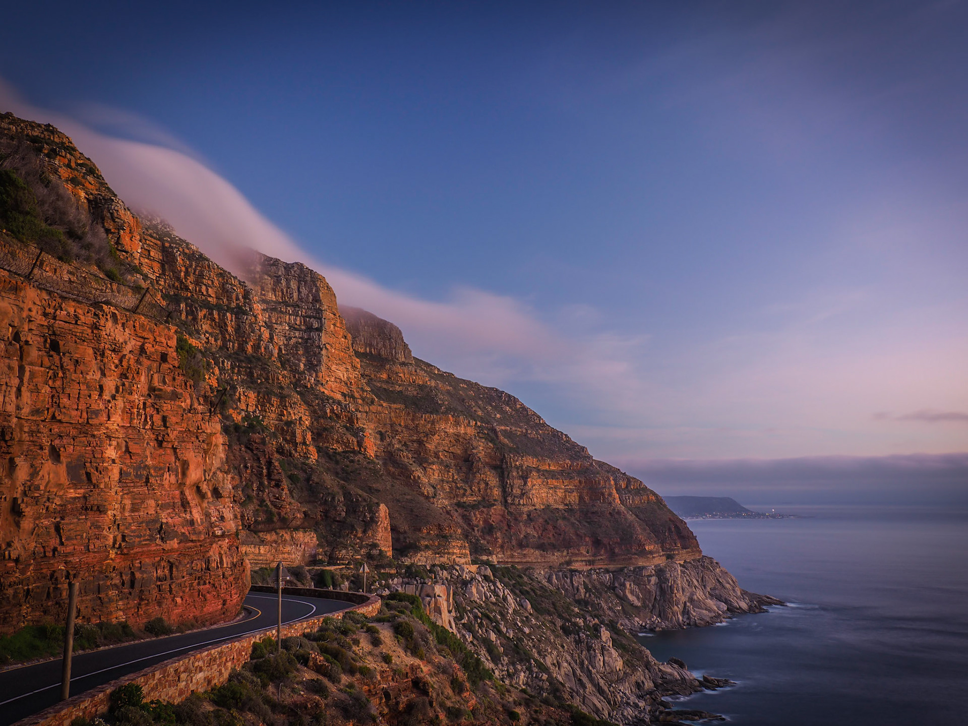 The coastal road winds its way down from Chapmans Peak southwards outside Cape Town, South Africa
