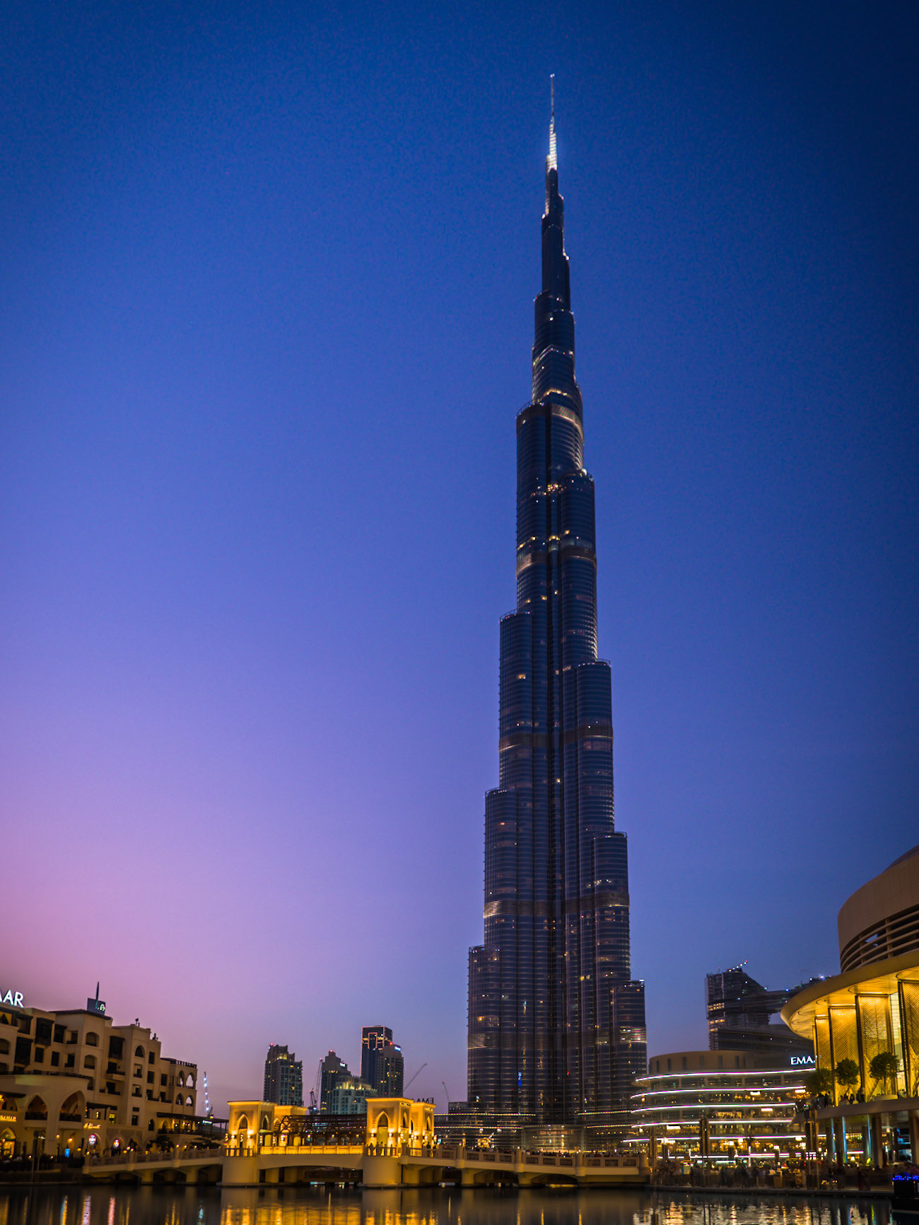 The tallest building in the world, Burj Khalifa, stands tall as dusk falls over Dubai