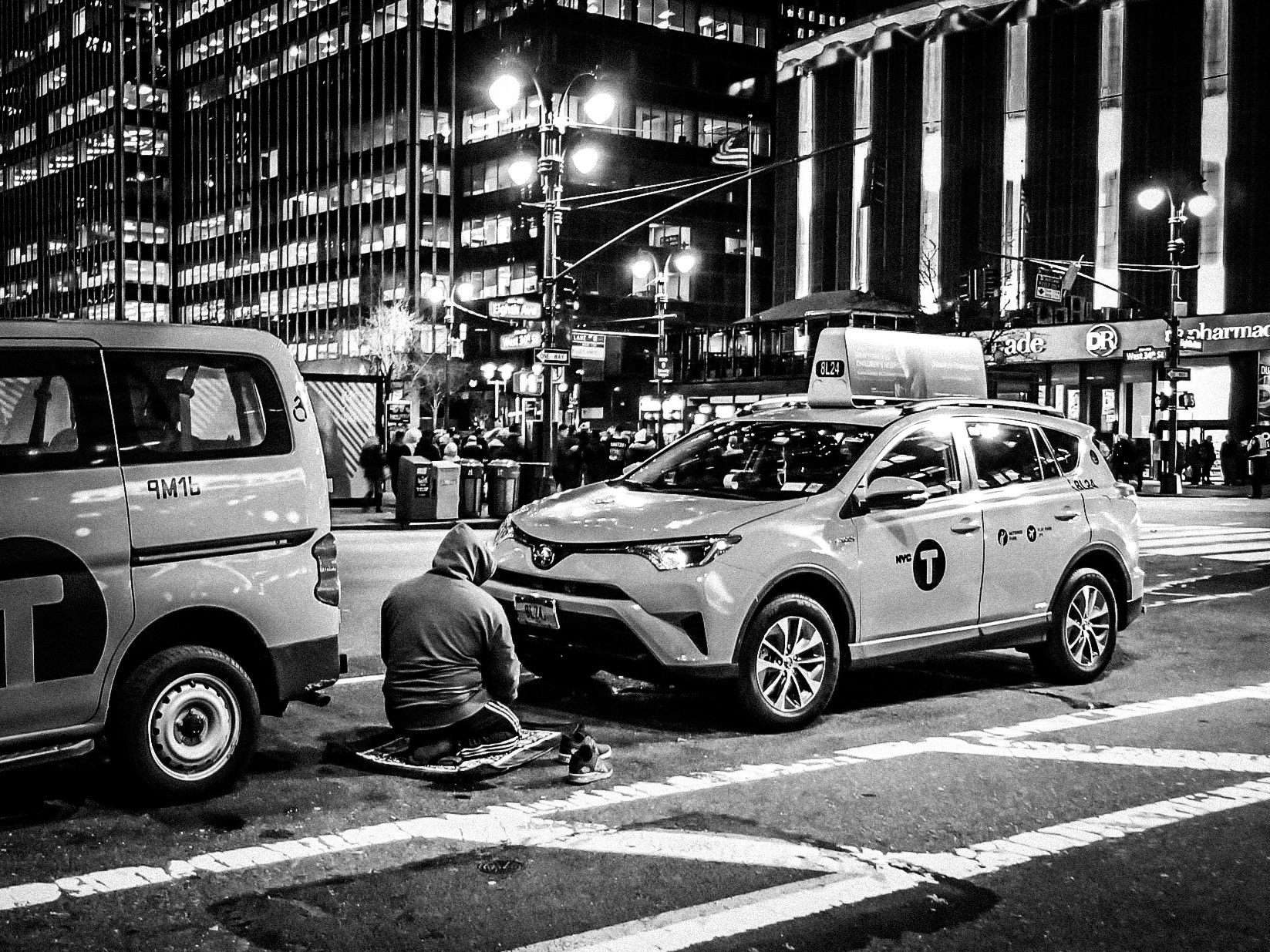 A Muslim taxi driver pauses his working day to perform Isha prayers in Manhattan, New York