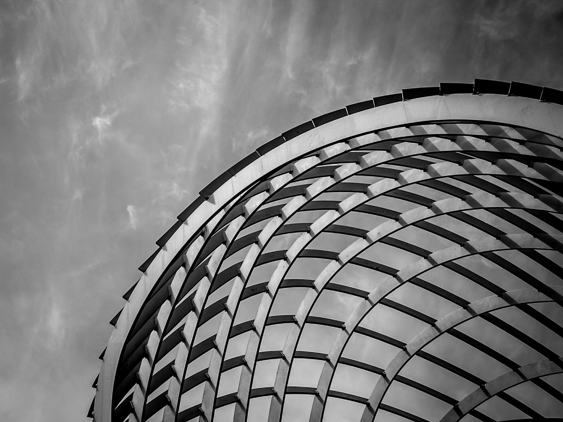 Cirrus cloud floats high in the sky above a small park in Santa Monica