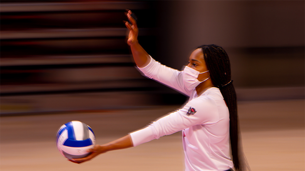 Pam Chukwujekwu serves against Clemson on Friday, March 19, 2021.