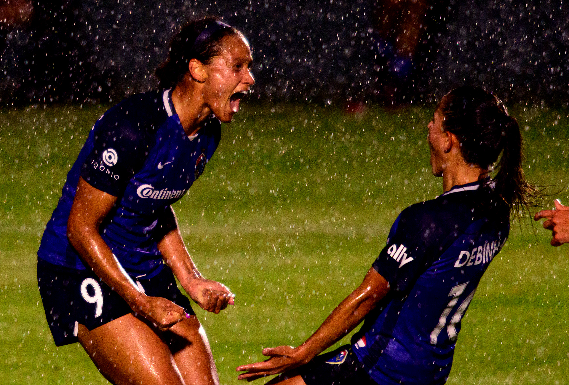 Lynn Williams celebrates scoring on an assist from Debinha on May 28, 2021.