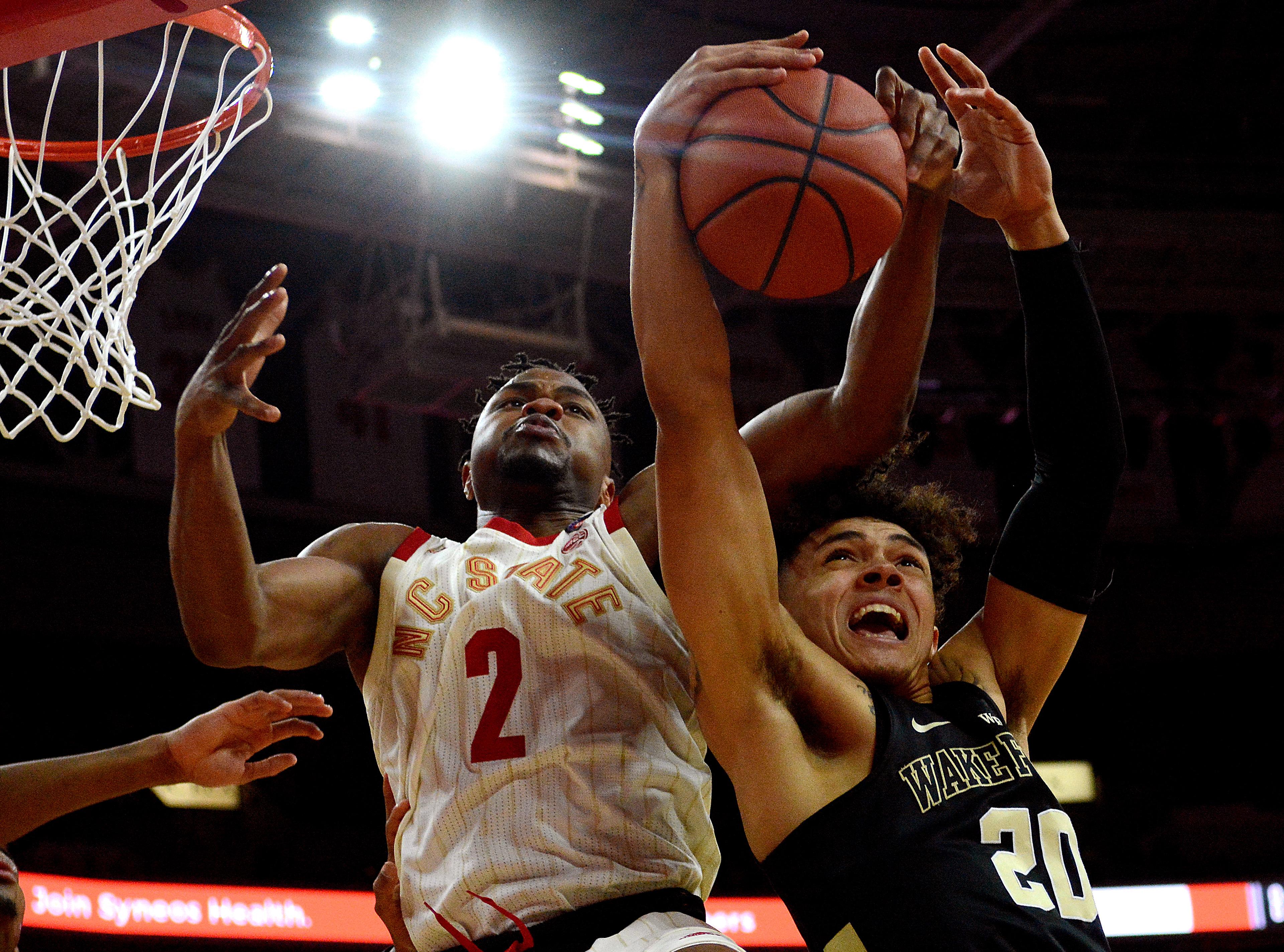 Torin Dorn fights for a rebound against Wake Forest's Michael Wyman on Feb. 24, 2019.