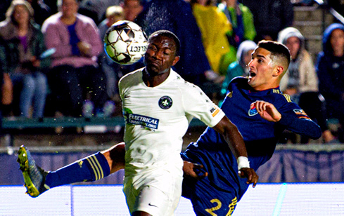 Manny Perez deflects the ball off Kamdem Fewo's face on Oct. 19, 2019.