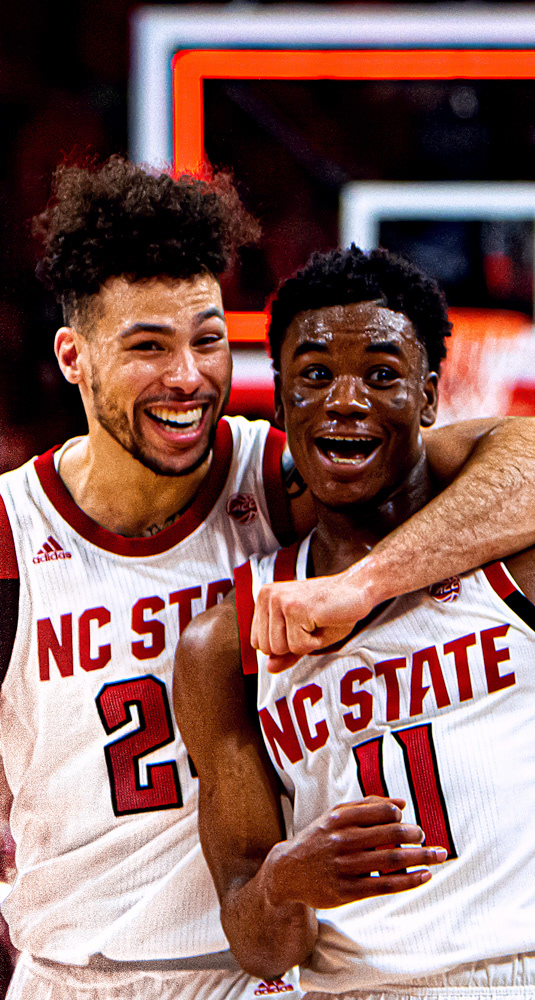 Markell Johnson celebrates his buzzer-beater alongside Devon Daniels.