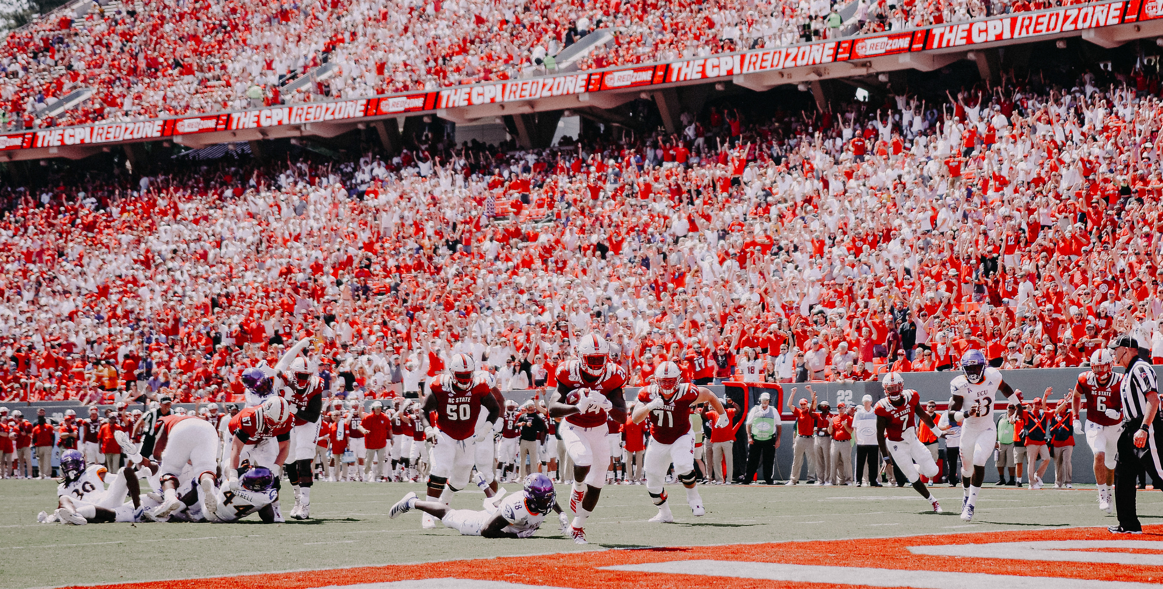 Freshman Zonovan Knight scores the first touchdown of the Wolfpack's season on Aug. 31, 2019.