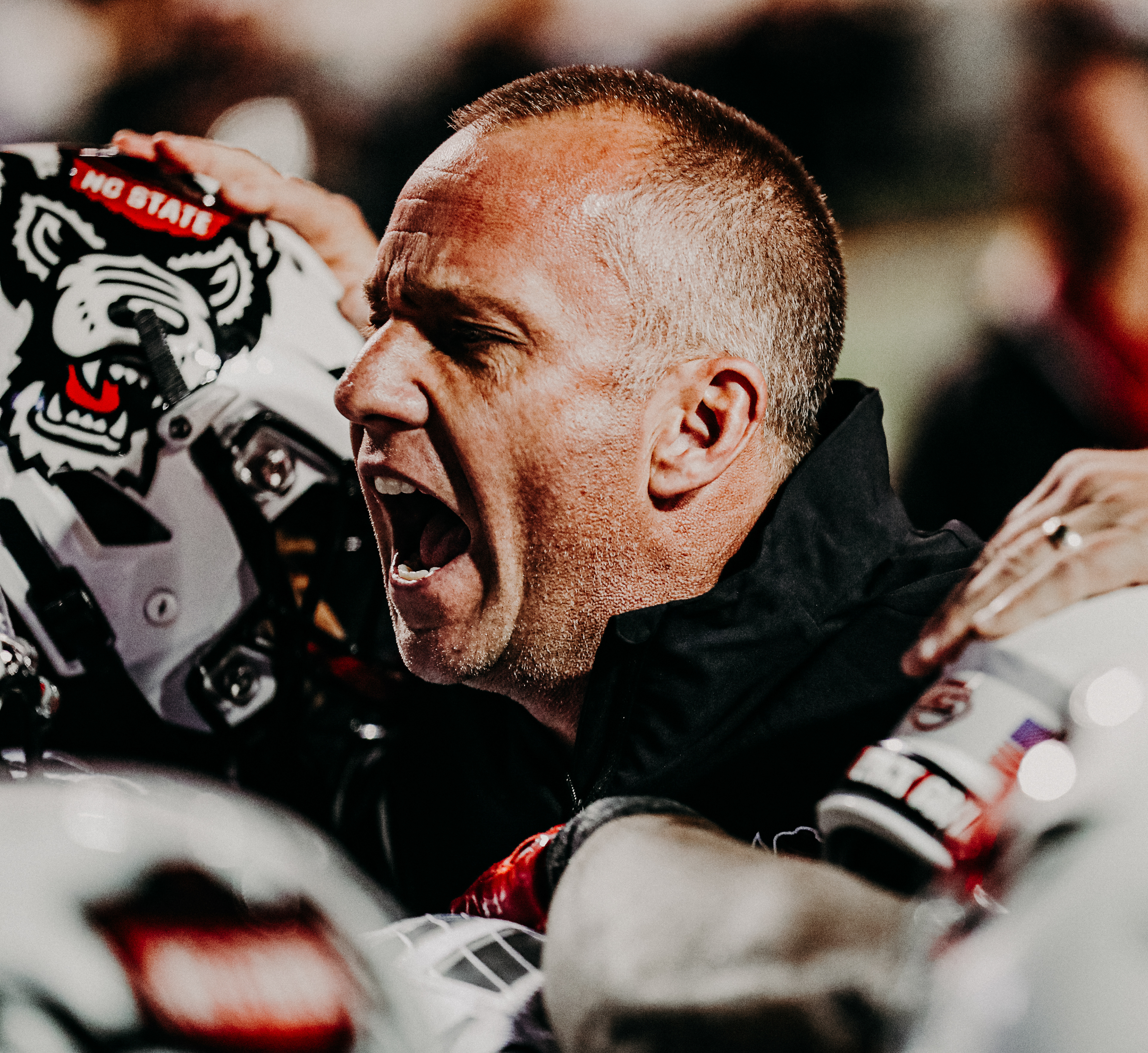 Head coach Dave Doeren leads the team onto the field to play Syracuse on Oct. 10, 2019.