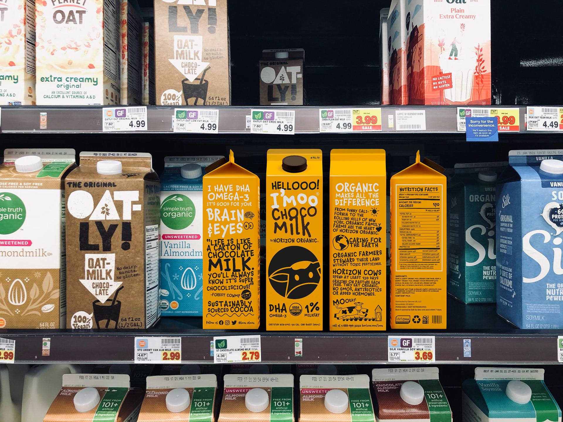 I'moo chocolate milk packaging with circle cow logo mocked up in a store milk section refrigerator