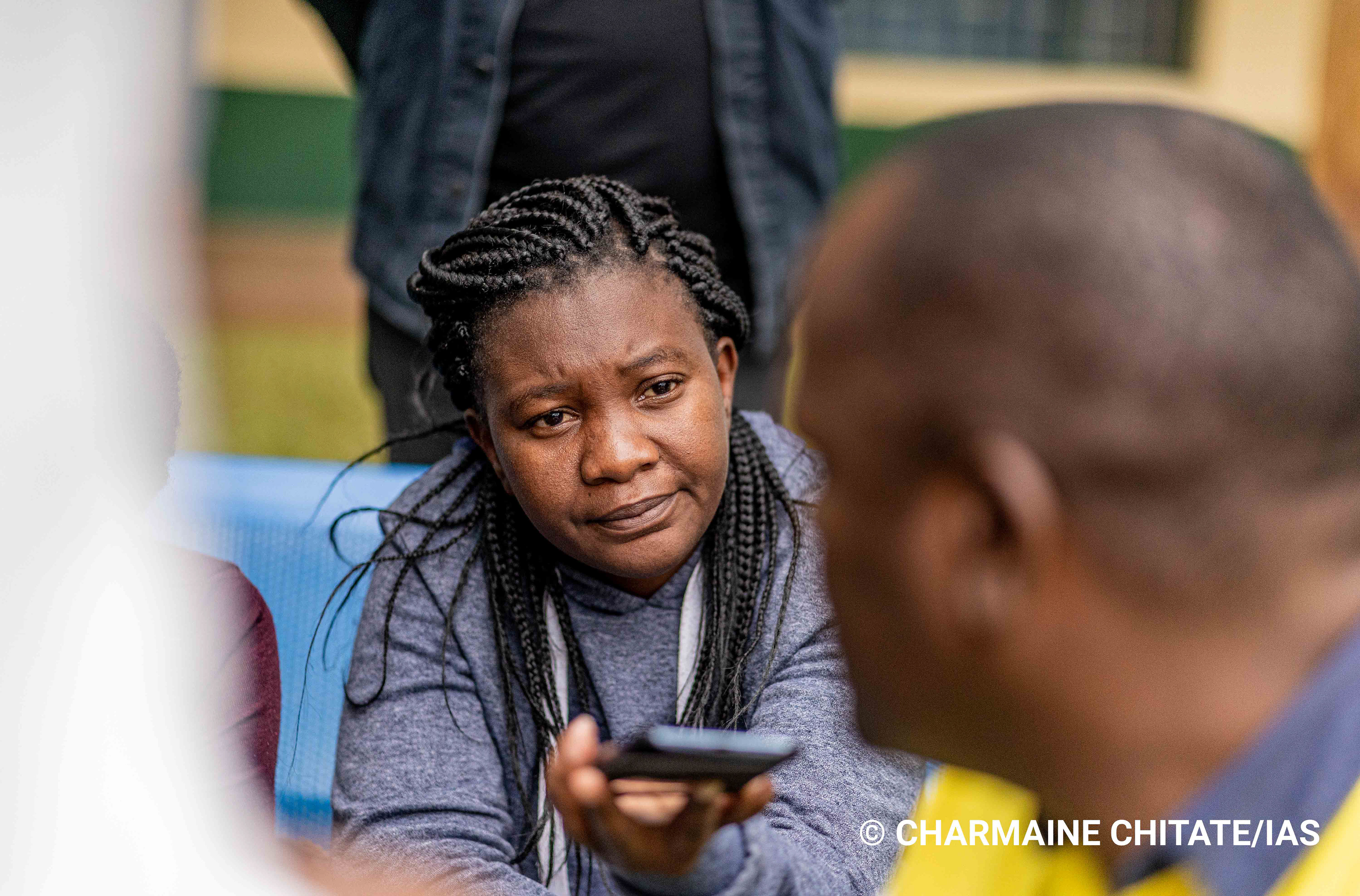 Anna Miti, a senior journalist at one of Zimbabwe's prestigious media houses conducts an interview at Ngezi Medical Clinic in Ngezi. (Photographer: Charmaine Chitate/IAS)