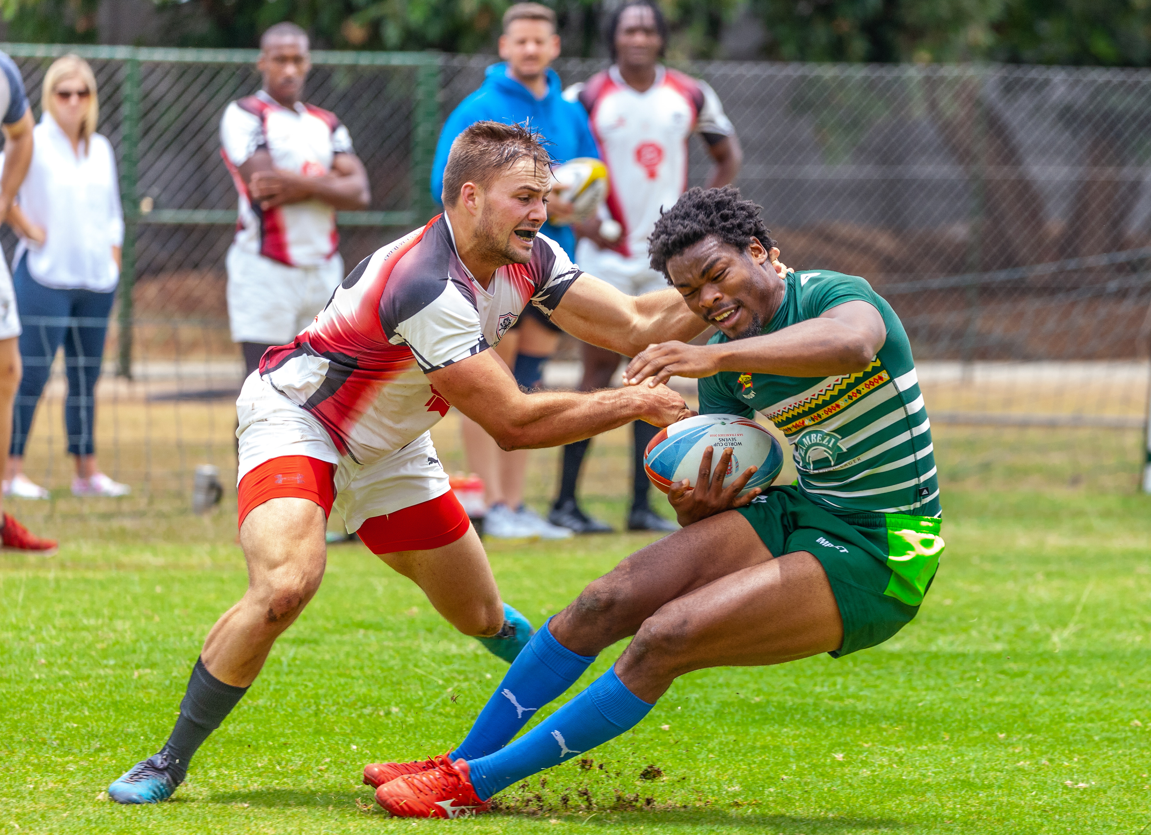 © Charmaine Chitate. Old Georgians RFC's Daniel Capsopoulos tackles Cheetahs' Biselele Tshamala- with ball in hand
