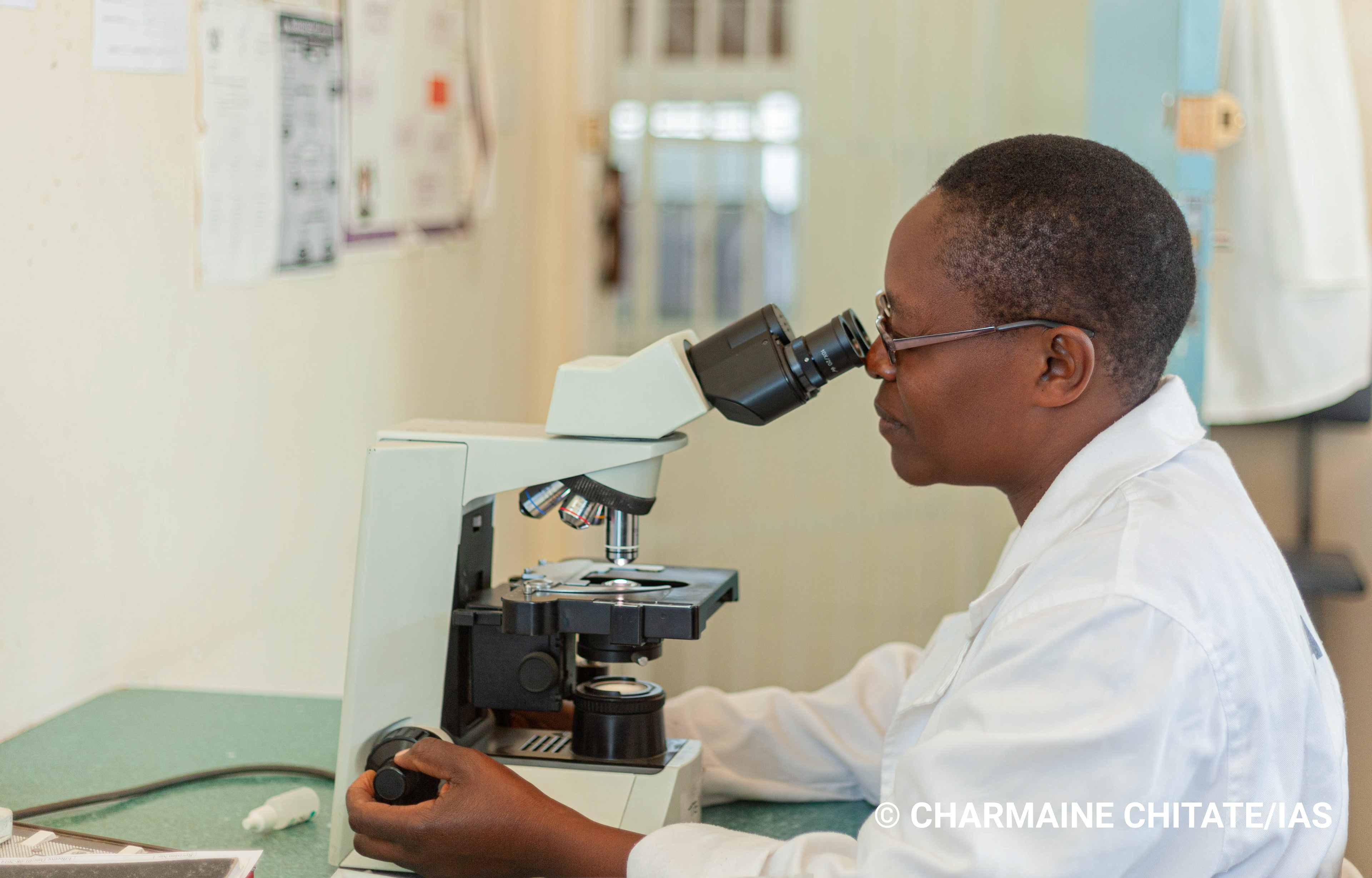Mazvita Chataurwa is a Microscopist at Rutsanana Polyclinic in Harare, attending to betwwen 135 - 150 sputum samples a month. (Photographer: Charmaine Chitate/IAS)
