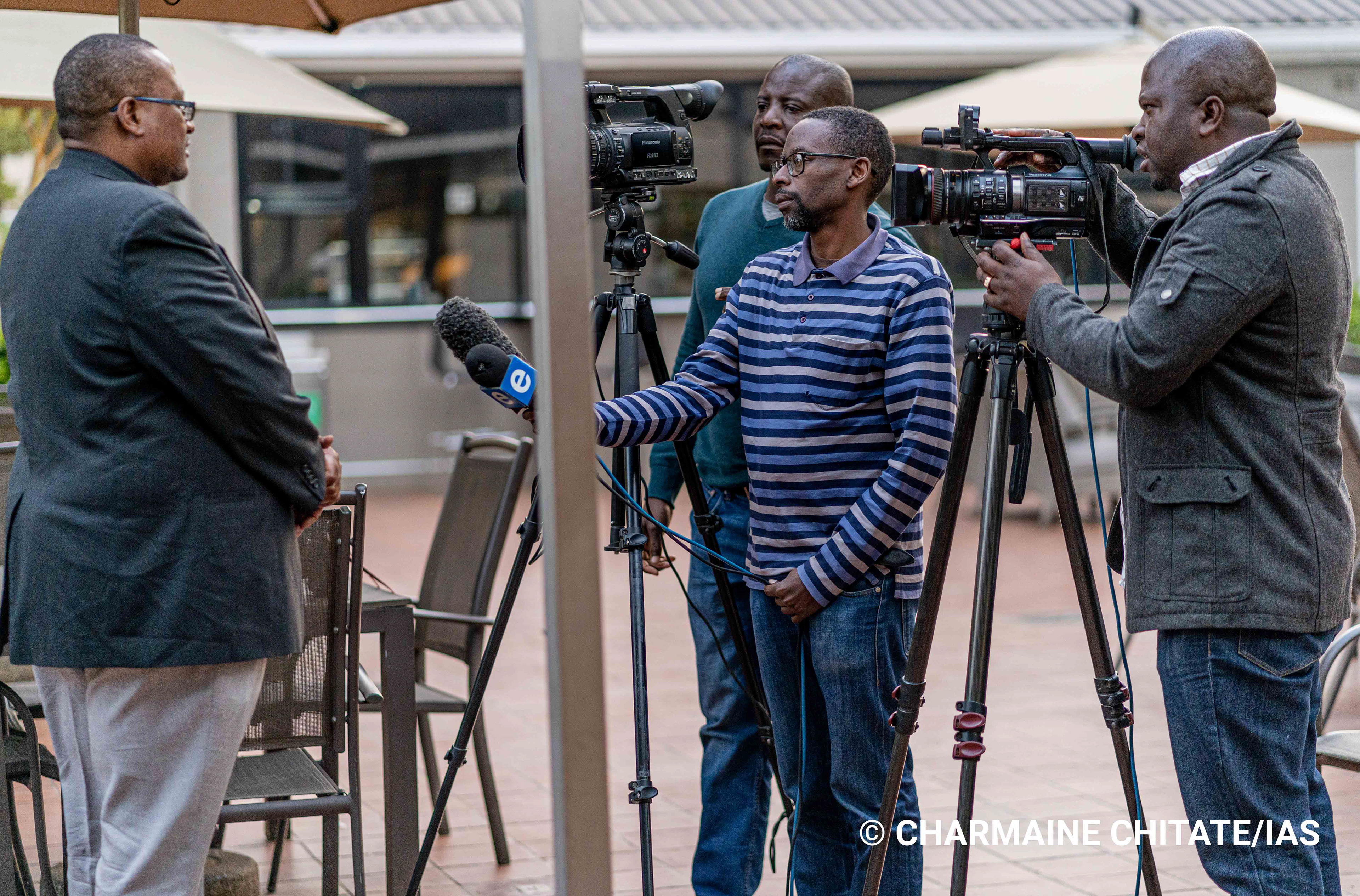 Journalists from eNCA and AFP interview Dr. Charles Sandy from the Ministry of Health and Child Care. (Photographer: Charmaine Chitate/IAS)