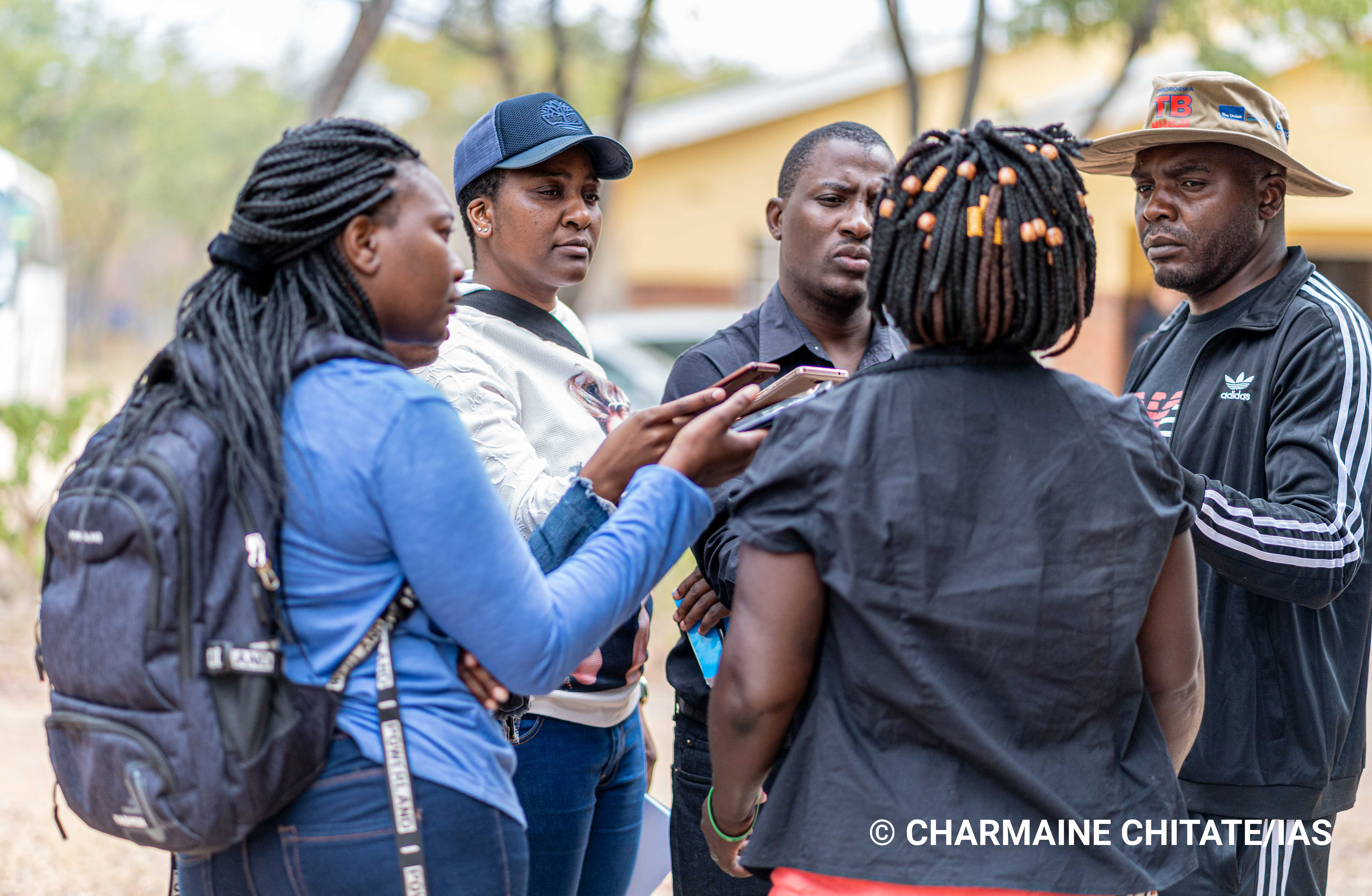 Journalists interview a village health worker at Turf Clinic in Ngezi. (Photographer: Charmaine Chitate/IAS)