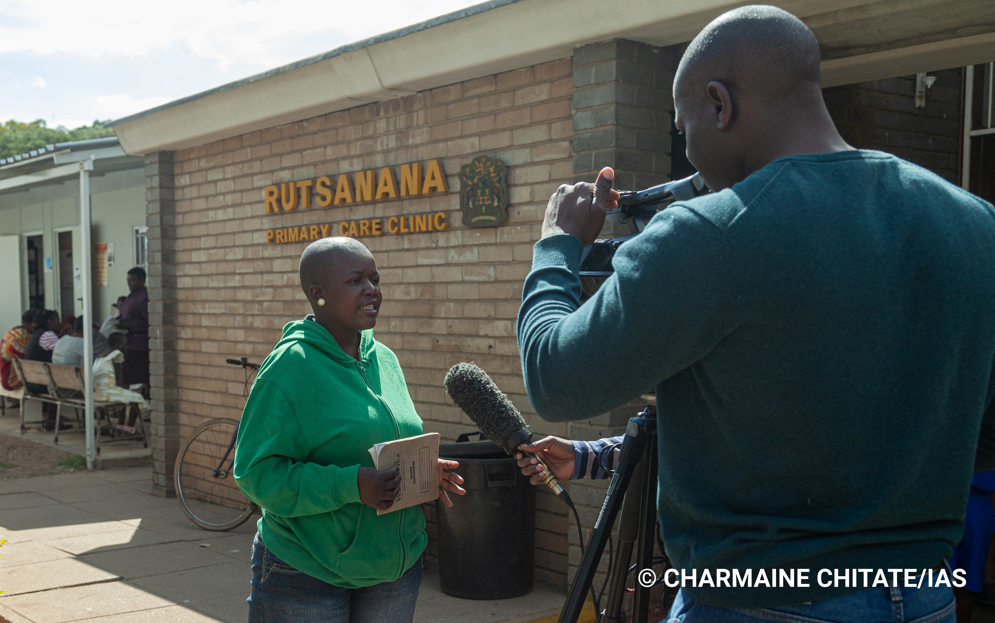 Journalists interview 28 year-old Charlene Masanga at Rutsanana Polyclinic during a Media Field Trip facilitated by the International AIDS Society (IAS). (Photographer: Charmaine Chitate/IAS)