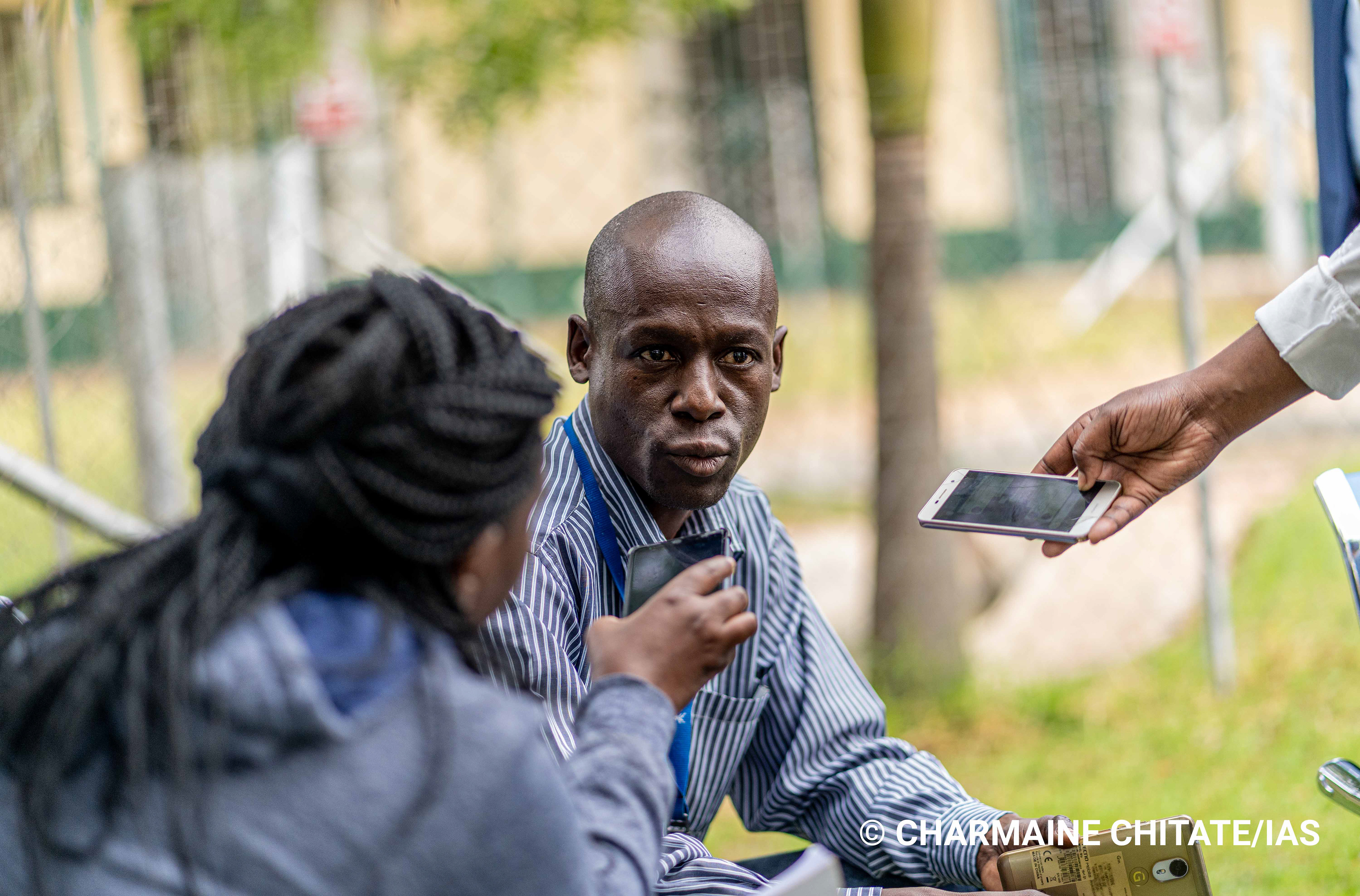 James Gauti (45), an employee at ZIMPLATS Mine, is interviewed by journalists on his treatment as a TB patient. (Photographer: Charmaine Chitate/IAS)
