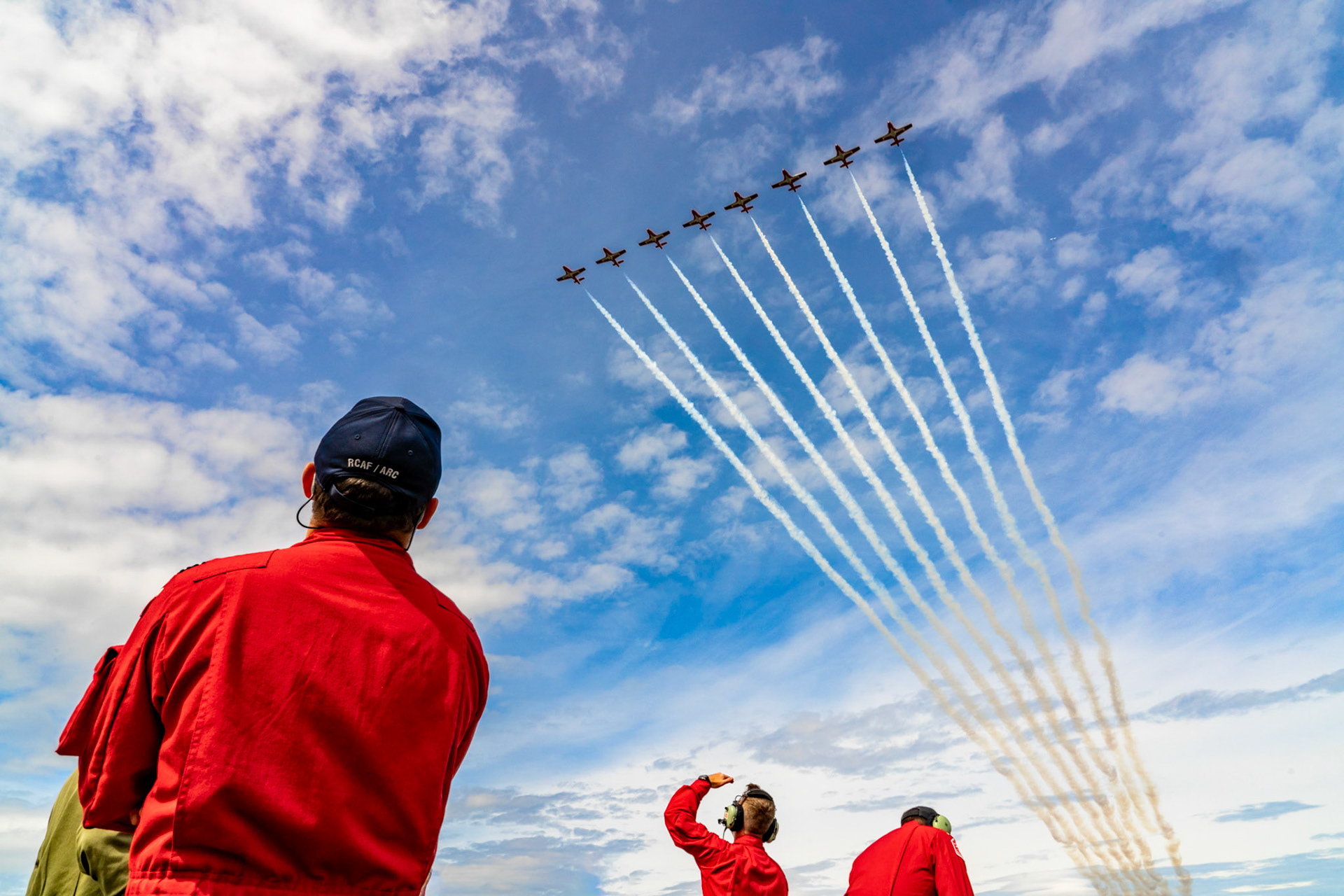 2024 Snowbird 5 Capt Thomas Thornton, 10 Capt Edward Soye,  11 Capt Rich MacDougall, looks up as the team flys over