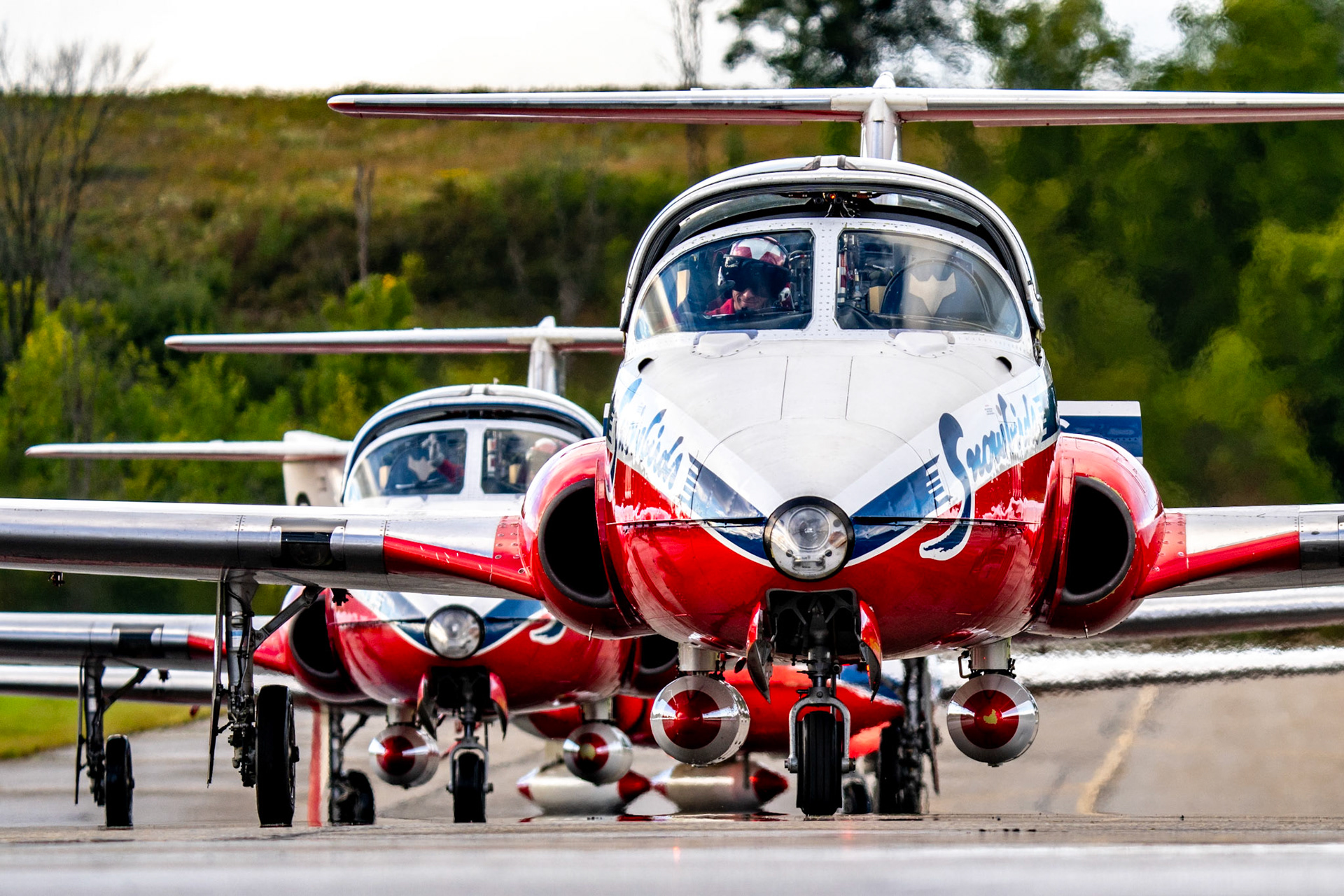Snowbirds Lead Maj Brent Handy waves as he leads the team in