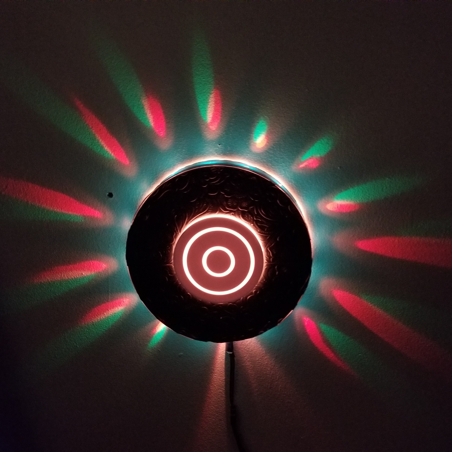 LED accent light utilizing circular 'points of light' wall reflection as well as frontal lighting effects.