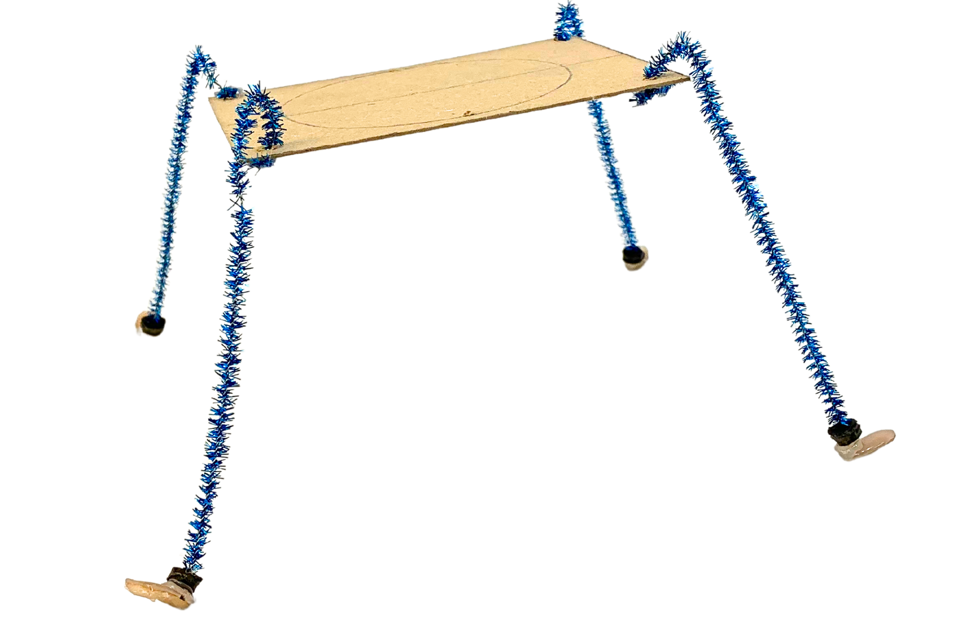 The pipecleaner legs are pliable, allowing rapid prototyping of leg iterations. This leg formation looks tall, but was too rigid and the high centre of gravity made it topheavy. 