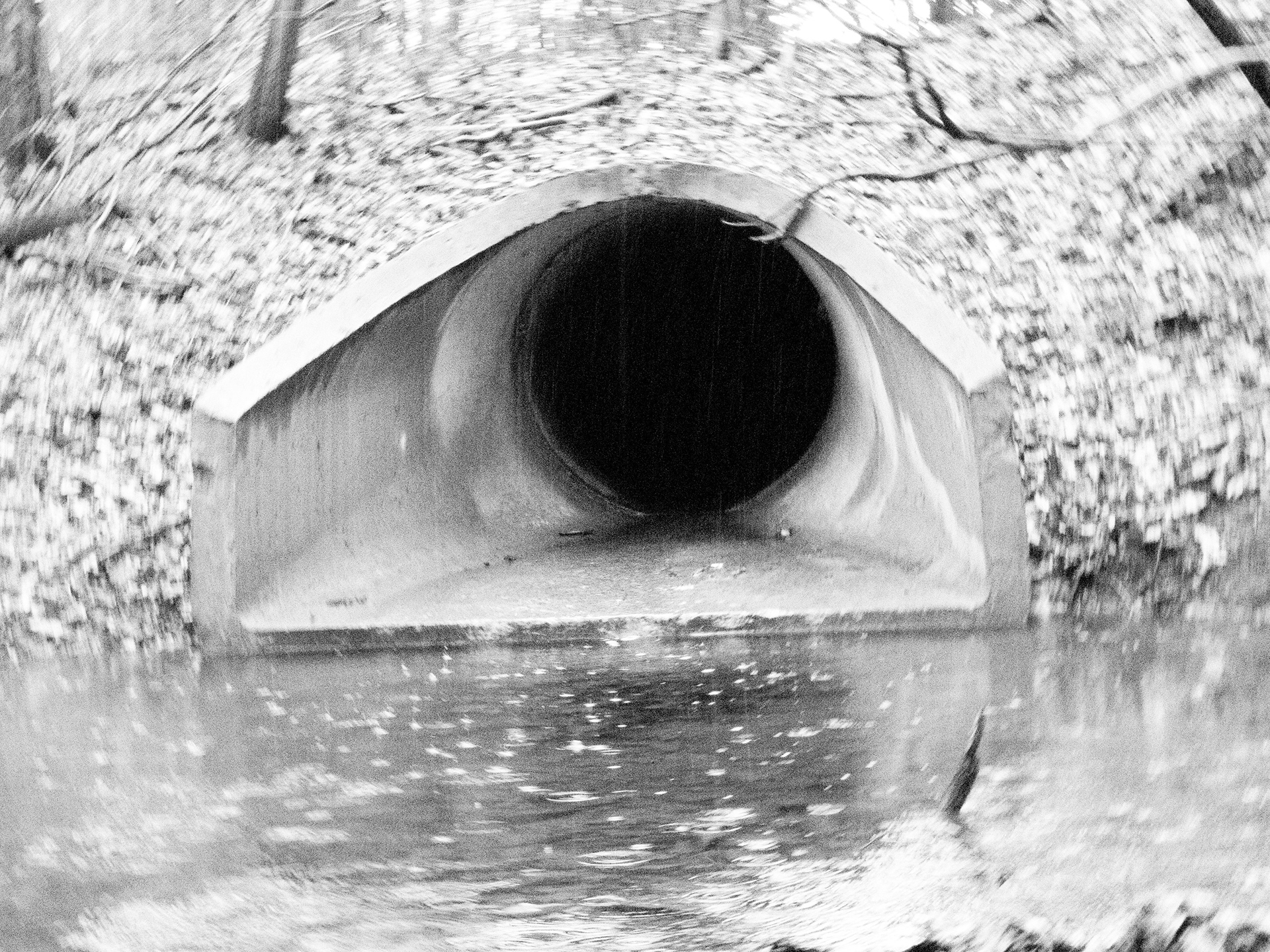 Rainy Exit Drain (Color altered) Unfortunately it was raining outside, but I still went outside in my backyard over to the exit drain and started snapping away photos with time. The pathway gives an ominous and dark feeling.