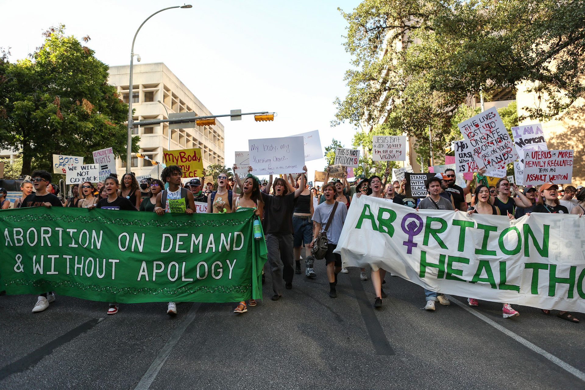 The crowd marches towards the courthouse plaza.'