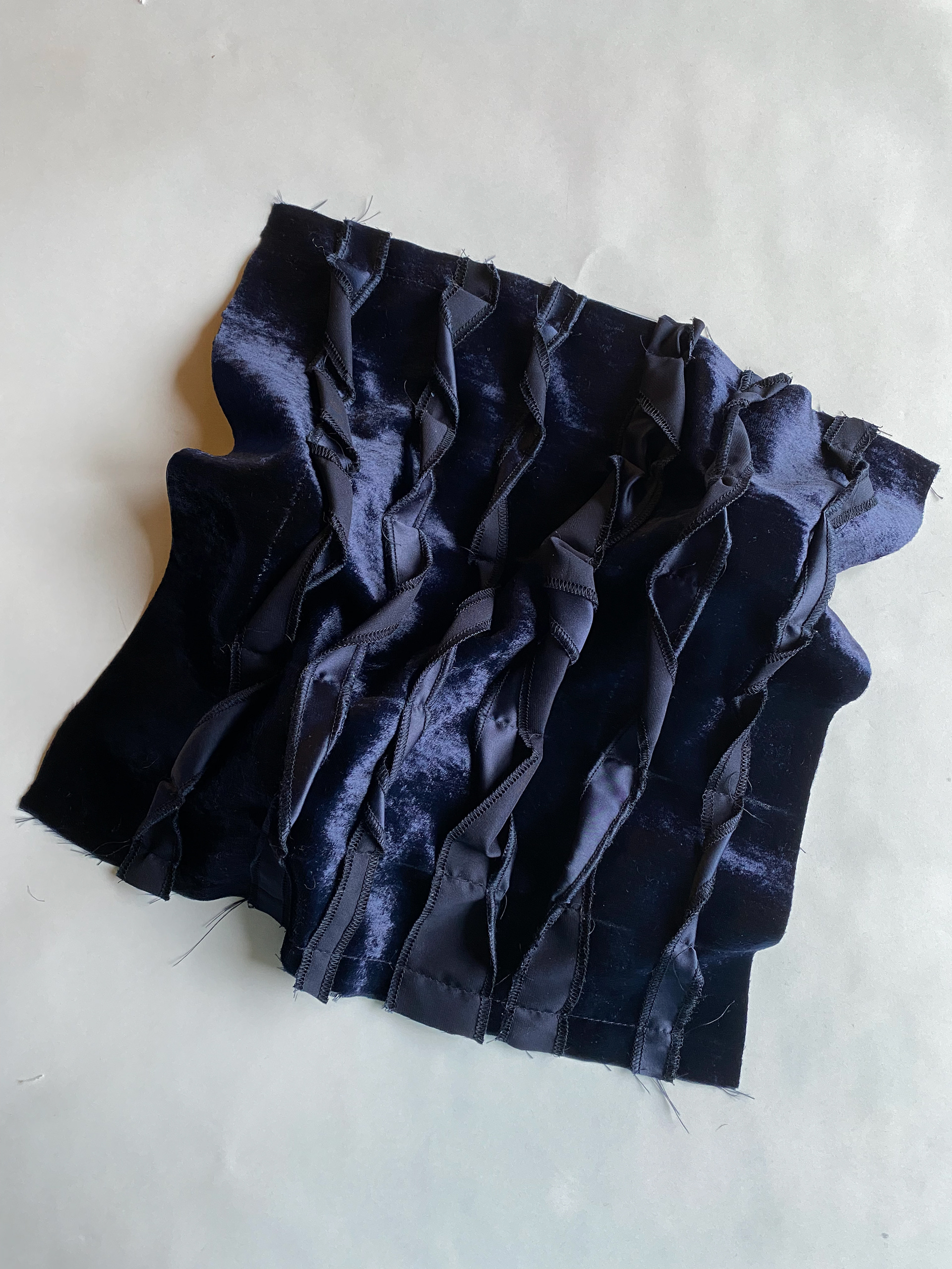 twisted sewn pieces of fabric and velvet