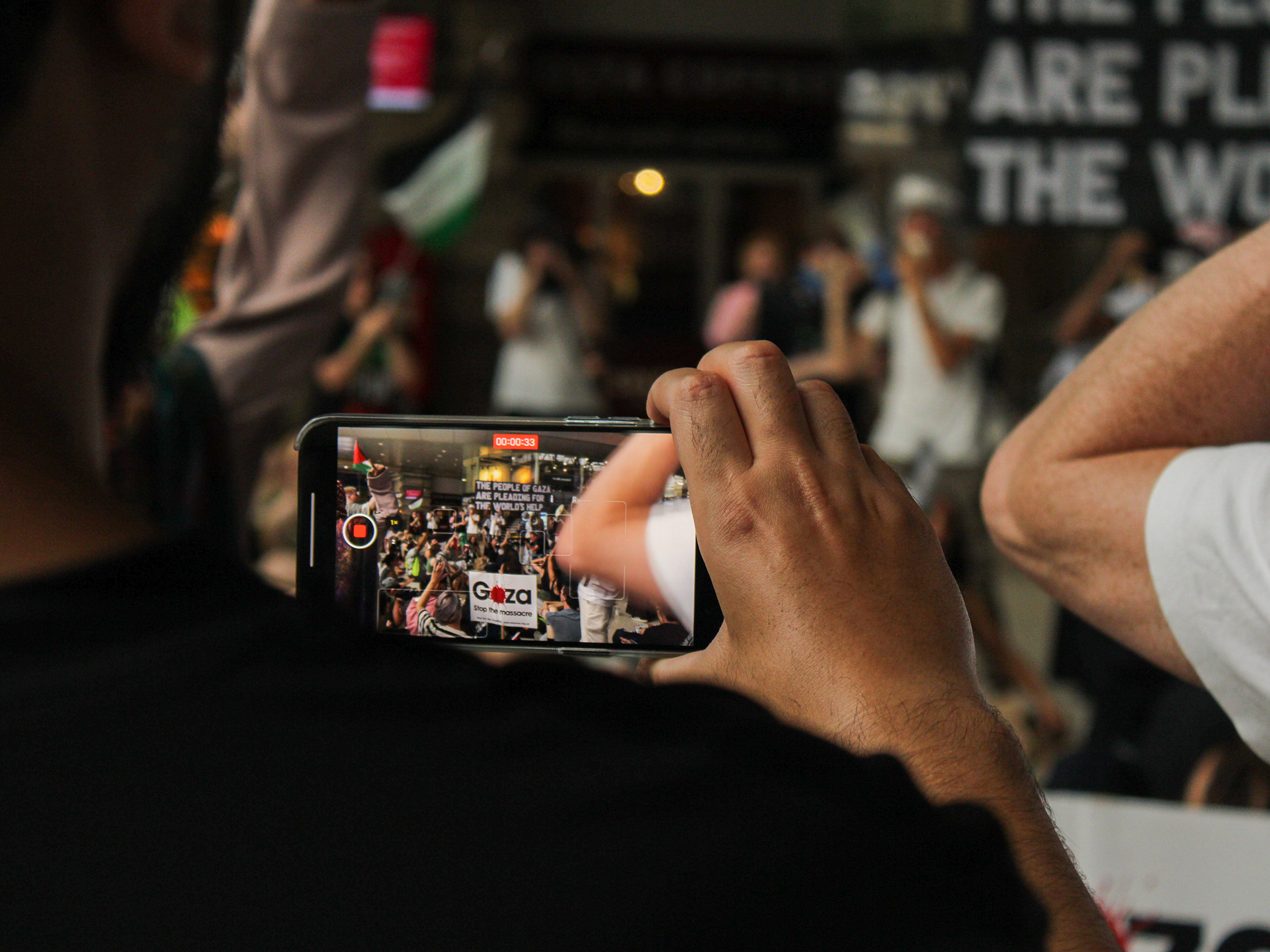 June 21st, 2025 - A bystander films a protest inside London Waterloo