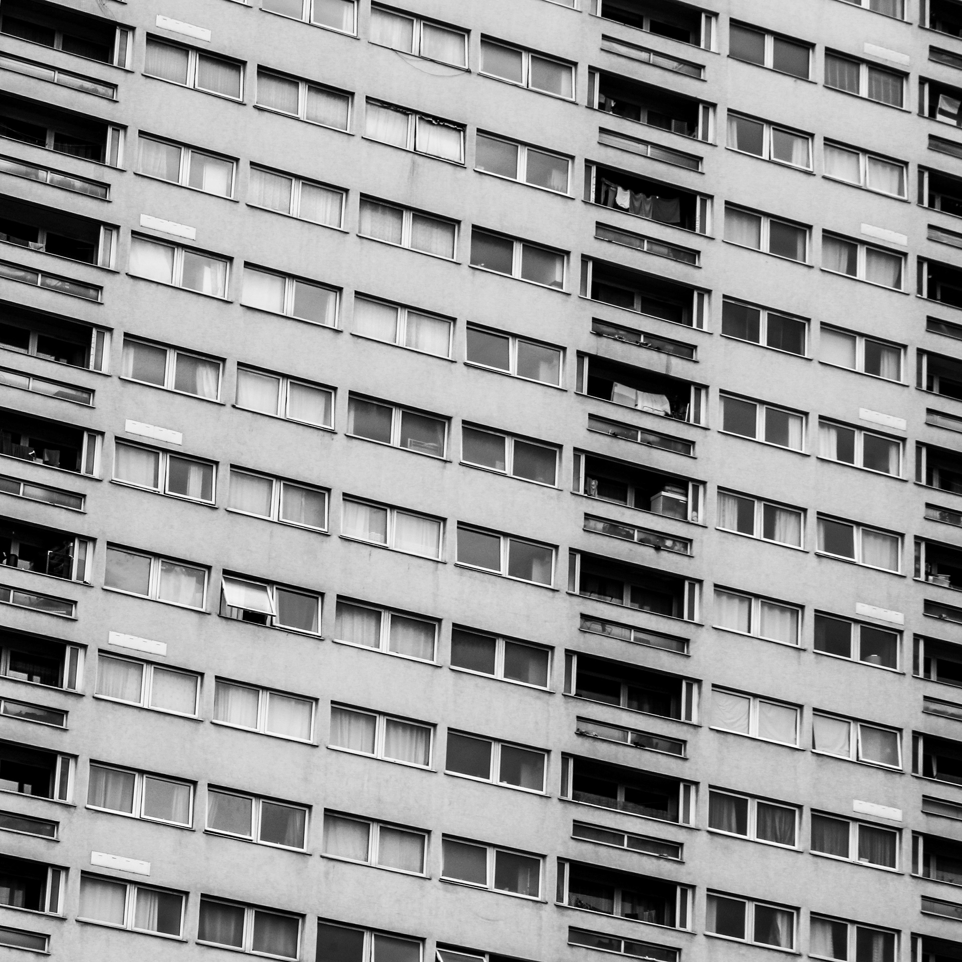 June 20th, 2024 - A black and white photo of a block of flats