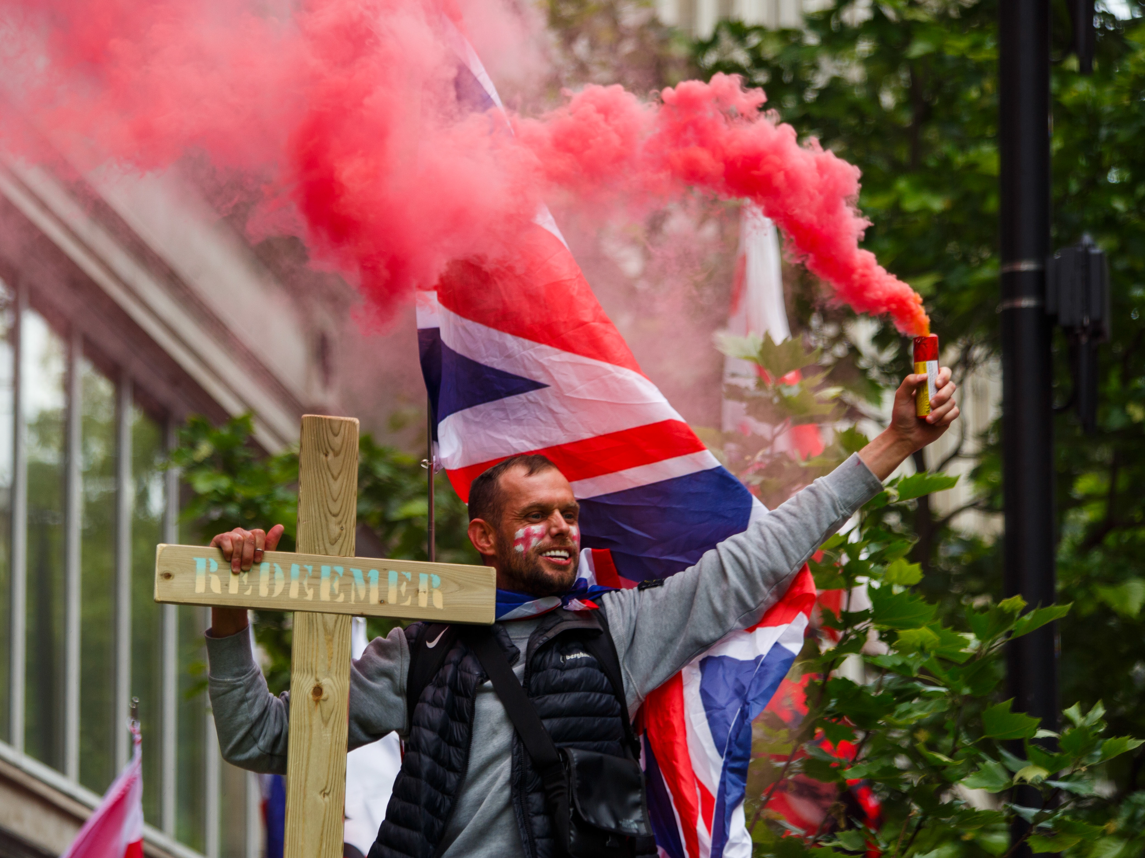 May 16th, 2026 - a protester lights a flare at the Unite the Kingdom rally