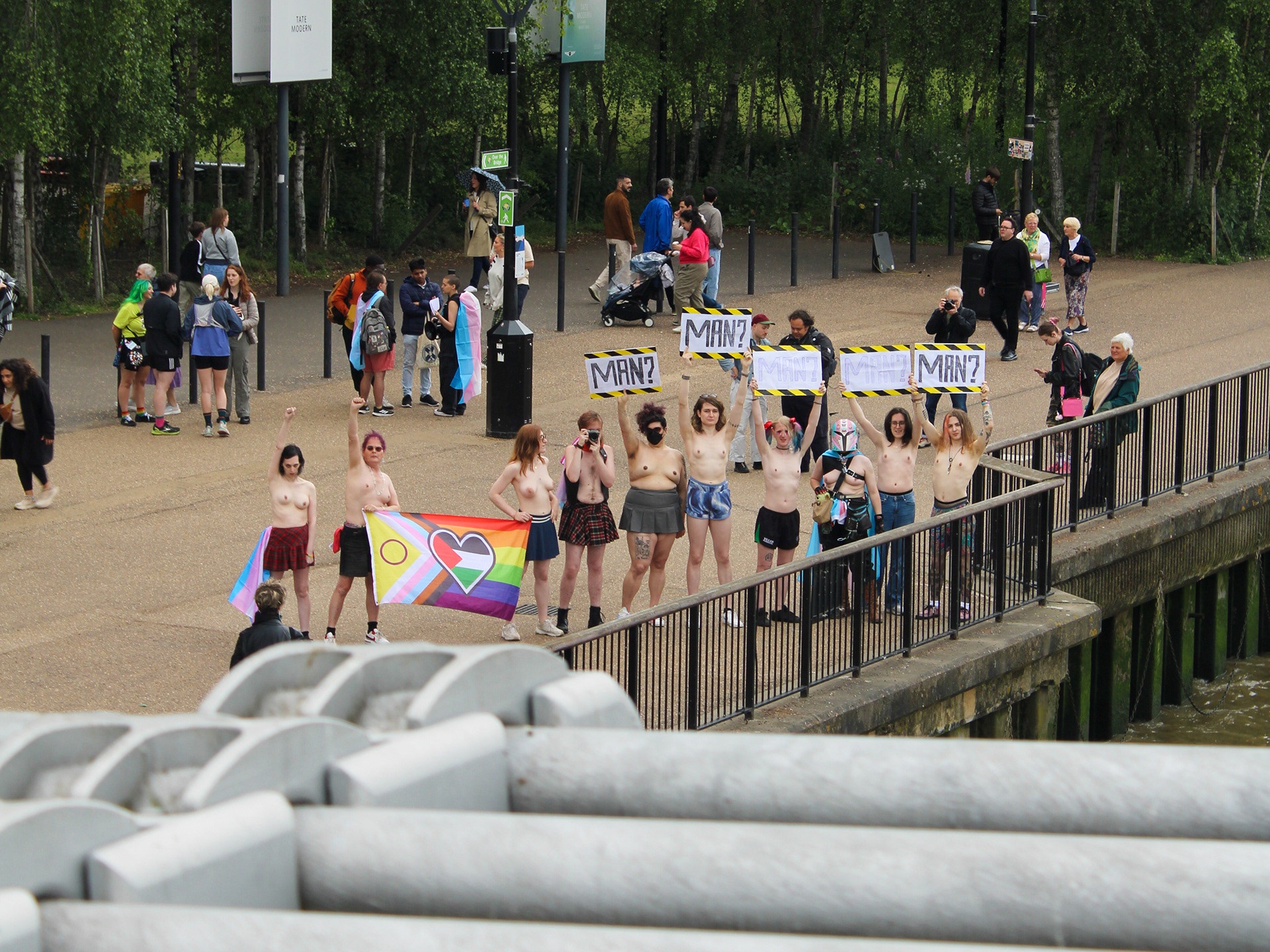 May 26th, 2025 - Topless trans protesters hold a shirtless demo outside of the Tate Modern