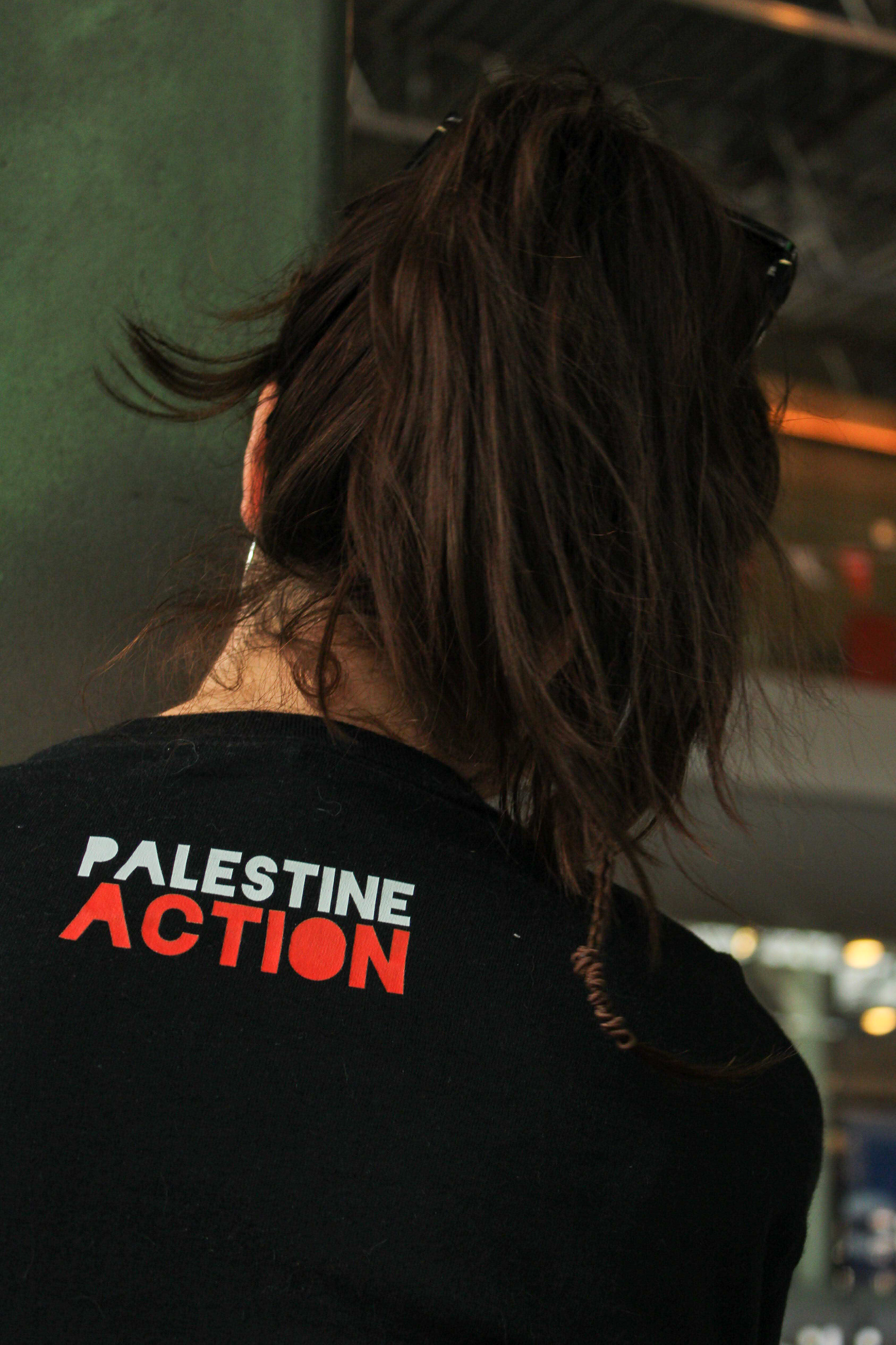 June 21st, 2025 - A protester wears a Palestine Action shirt