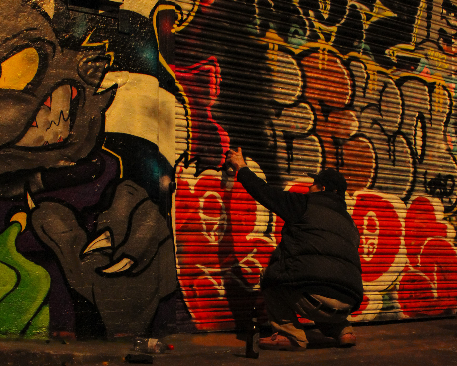 December 27th, 2024 - A street artist using spray paint in the Leake Street Arches