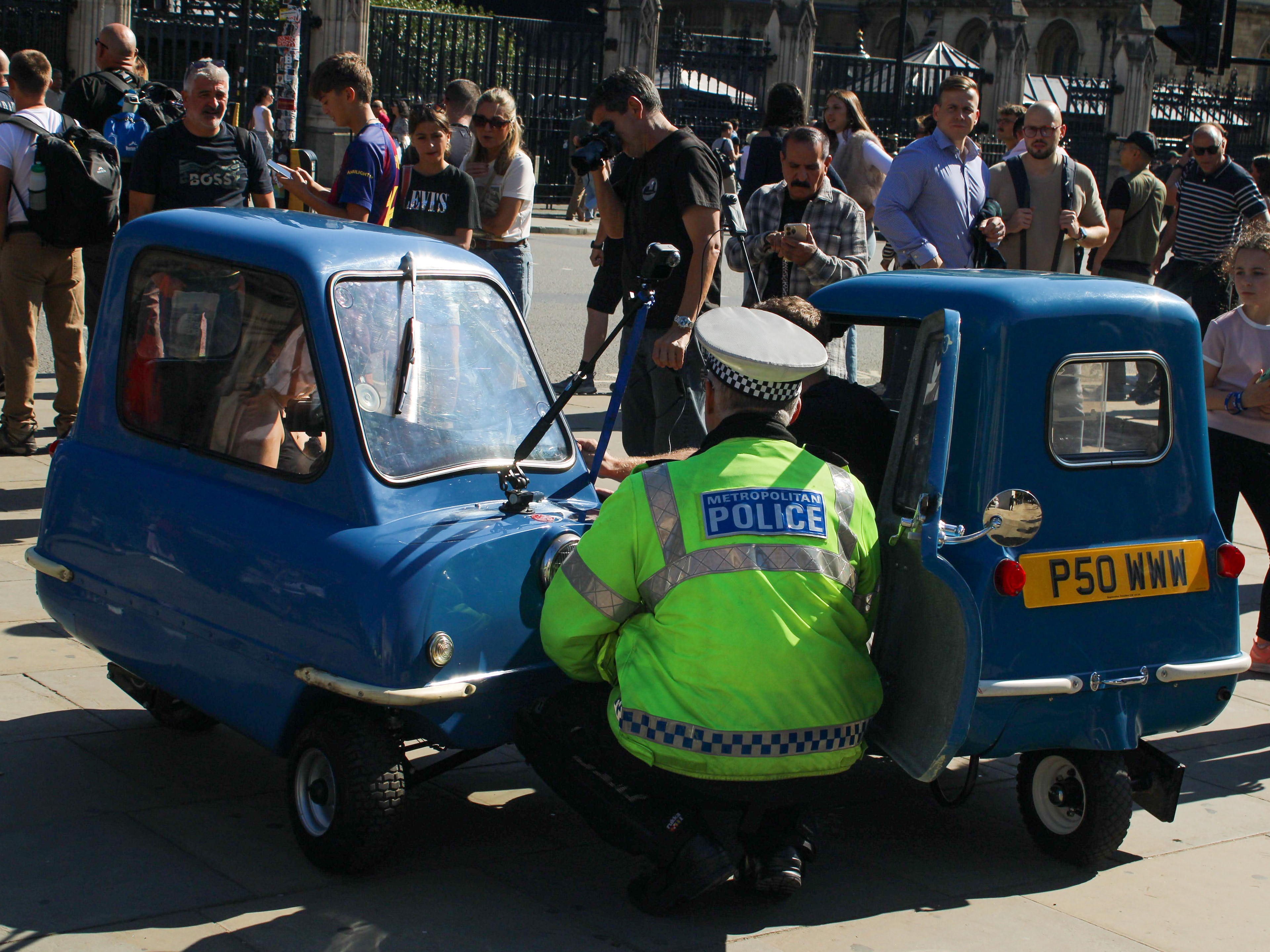 September 19th, 2025 - A met police officer stops two Peel P50s