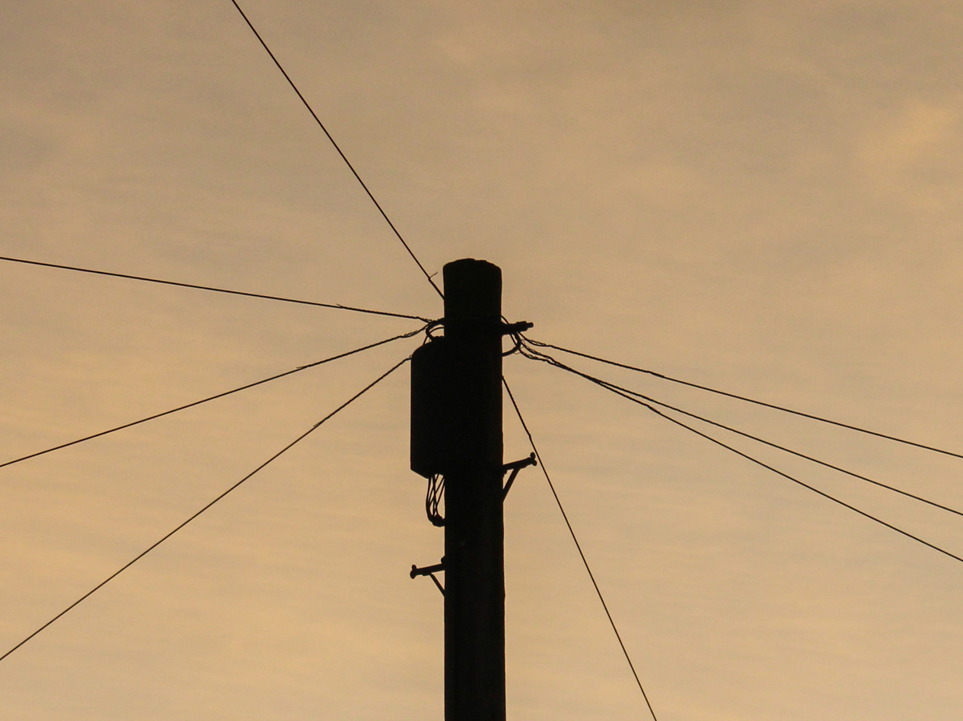 December 23rd, 2023 - A telephone pole at sunset