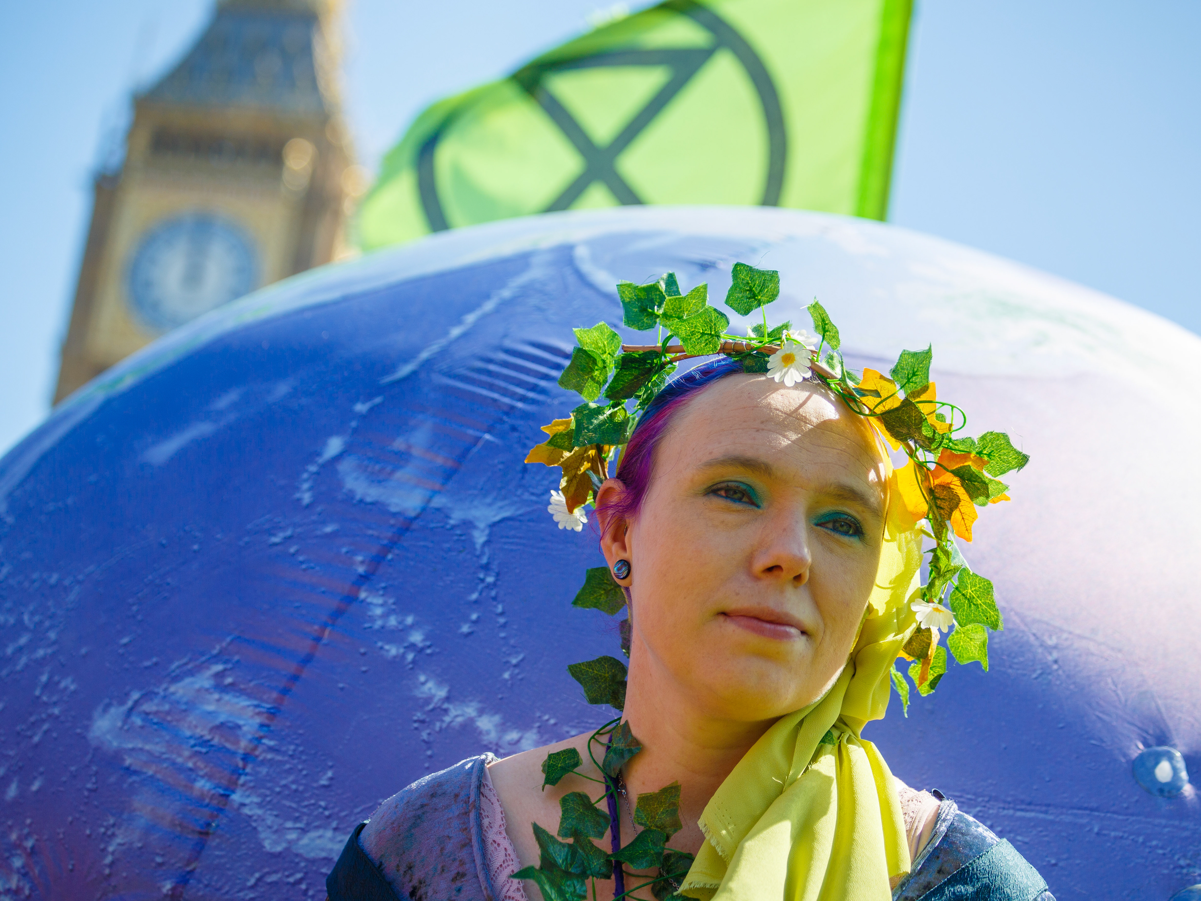 April 22nd, 2026 - A protester holds the "Earth" at a Extinction Rebellion protest