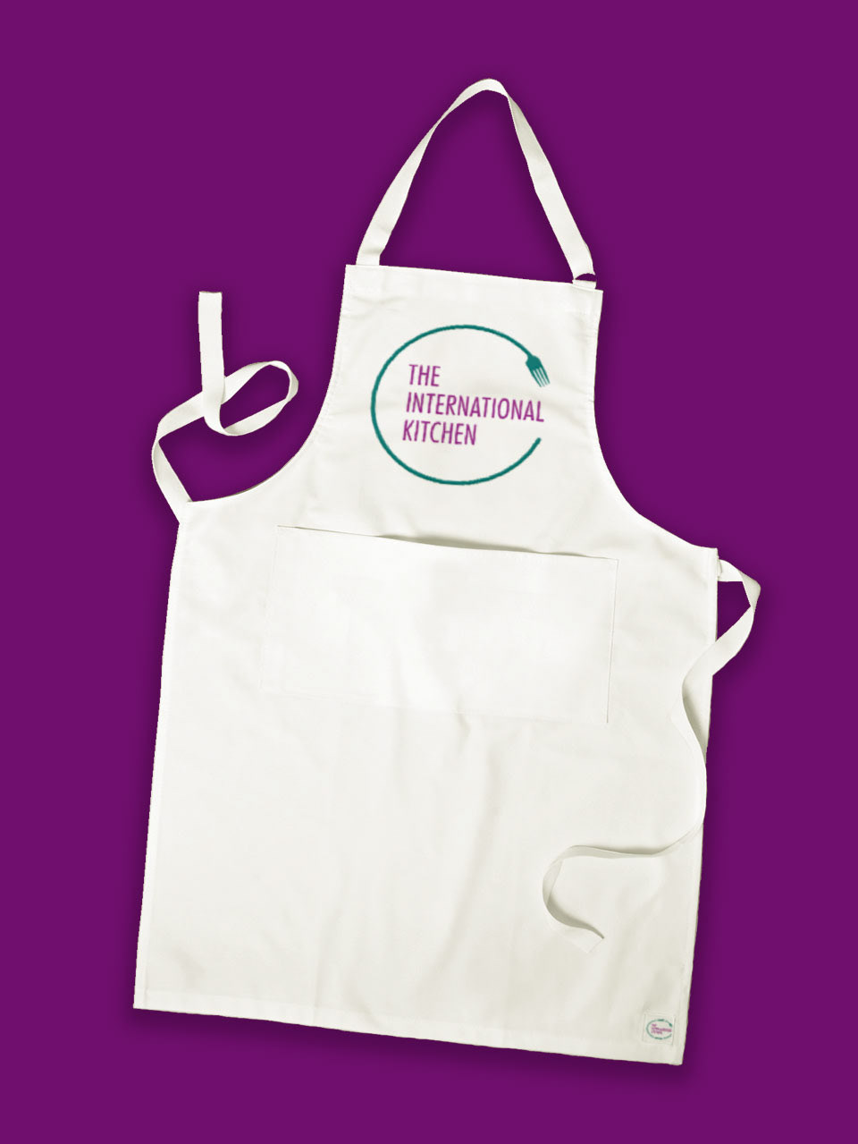 The International Kitchen printed their logo on white aprons, which is on a solid purple background.