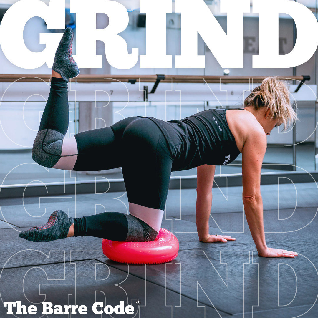 Image of a woman working out with the word 'Grind' repeated in the background.