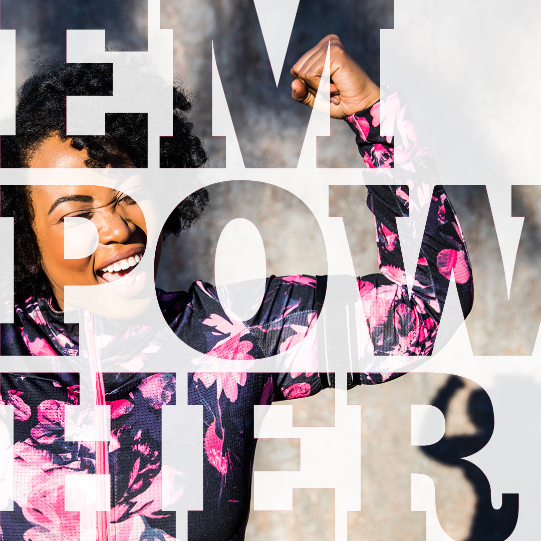 Bold, capital letters spelling 'empower' split between three lines, with an image of a strong, happy woman showing through the letterforms.