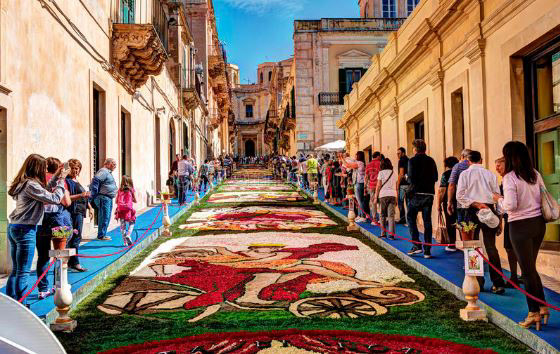 The Infiorata Festival in Italy sees entire roads and paths filled with designs made from sand, coffee grounds, limestone, flowers, pebbles, and other materials. Also a celebration of impermenance, the neighborhood kids are allowed to gleefully mess up all the drawings once the festival is over, in a tradition called "Il spallamento"