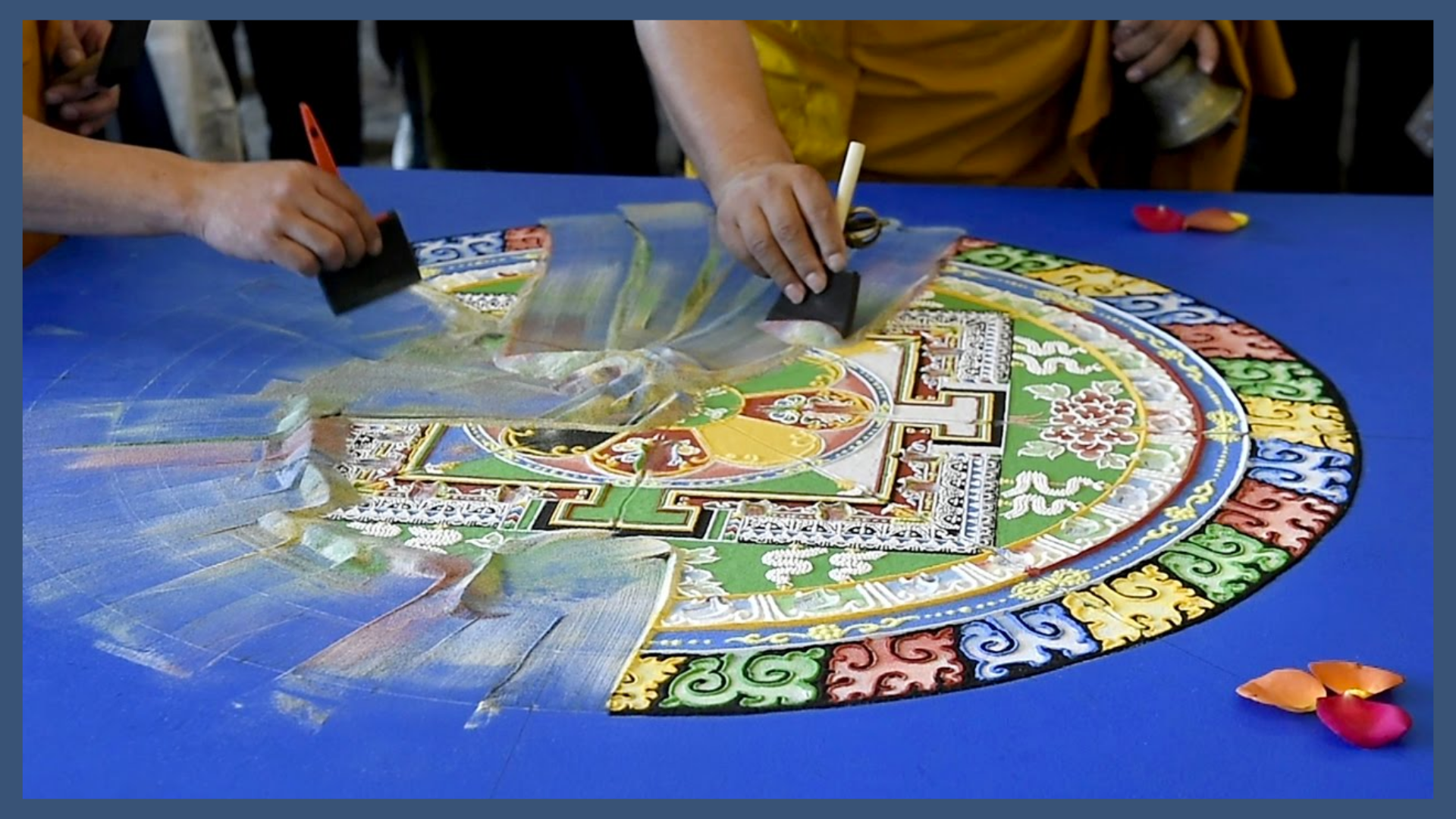 Destruction of Tibetan Buddhist sand mandala; monks spend days making an intricate mandala with different colored sand, then destroy it and bring it to the nearest body of water. The process symbolizes and enacts impermanence and non-attachment, and brings merit to all who witness or participate.