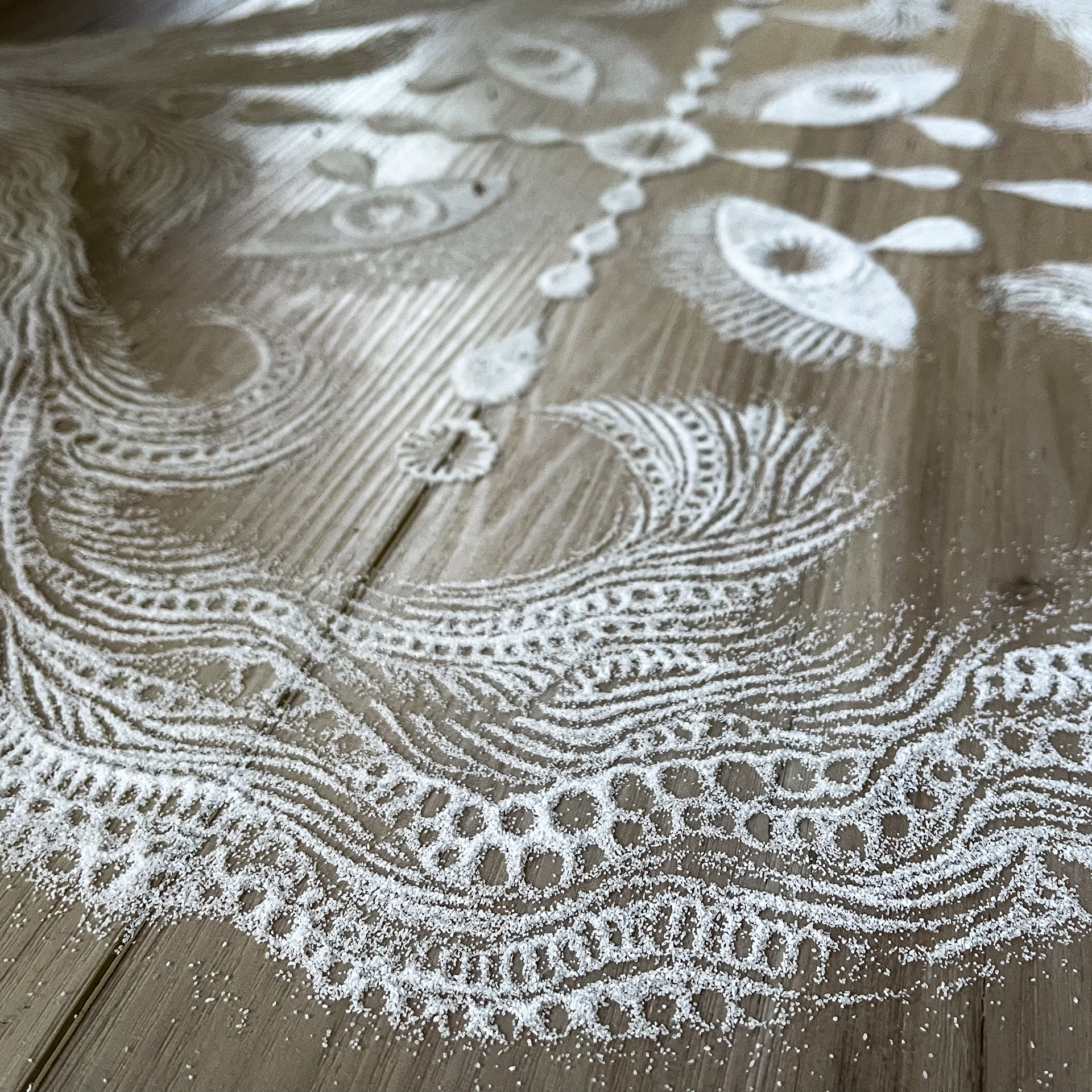 An eye mandala: eyes, tears, and sea foam.