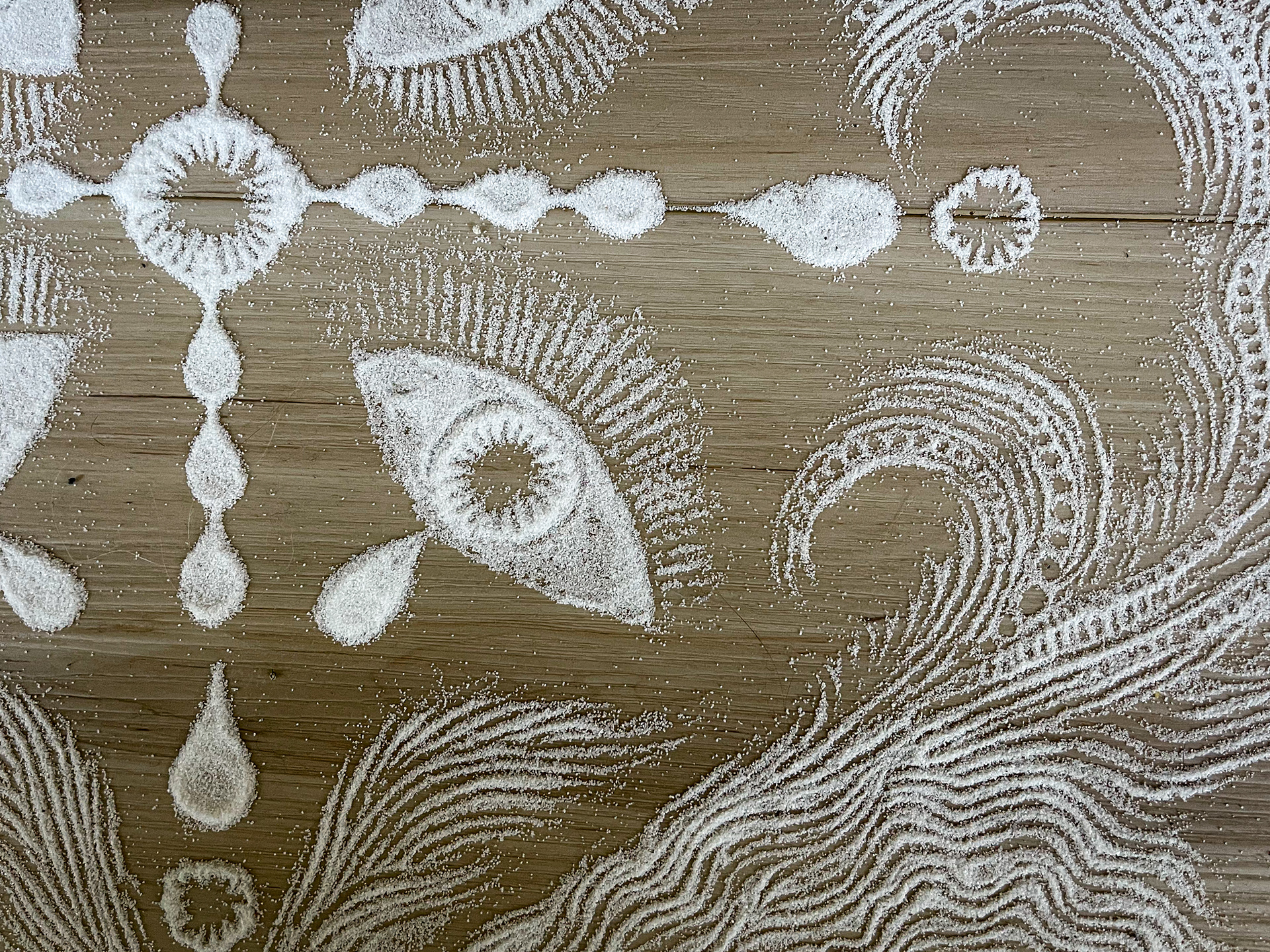 An eye mandala; eyes, tears, and sea foam.