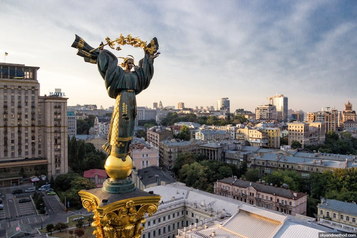 The outline for the main figure in my installation is loosely inspired by the Independence Monument in Maidan Nezalezhnosti (Independence Square) in Kyiv. Tall and angelic, the central statue is of Berehynia, goddess of protection and destiny in Ukrainian mythology. Her billowing sleeves look like angel wings as she holds a guelder-rose branch, which symbolizes the sun, moon, and stars (as well as blood, family, and roots/ancestors). .