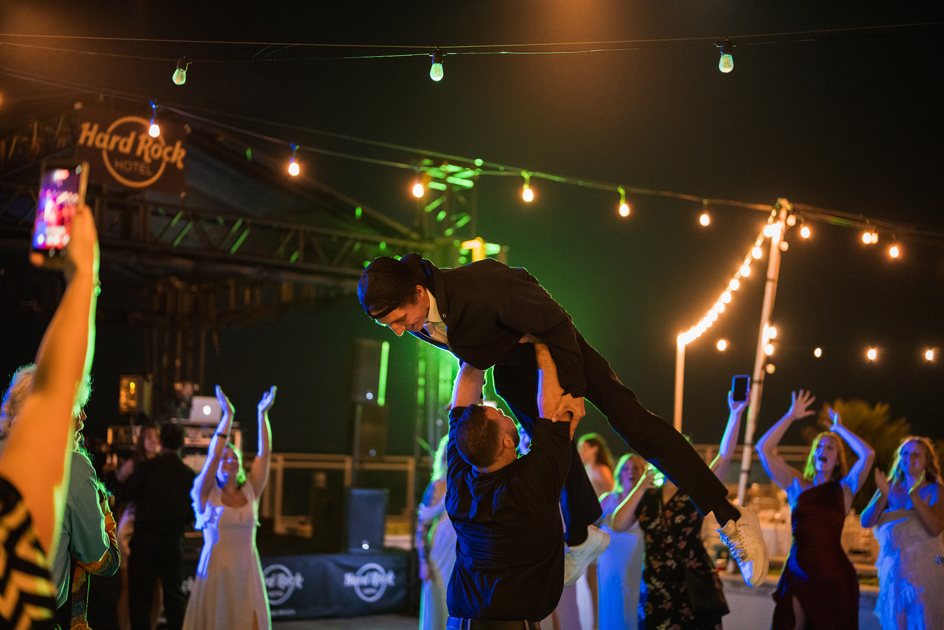 Best man being lifted on the dance floor during a Hard Rock Hotel Daytona Beach wedding.