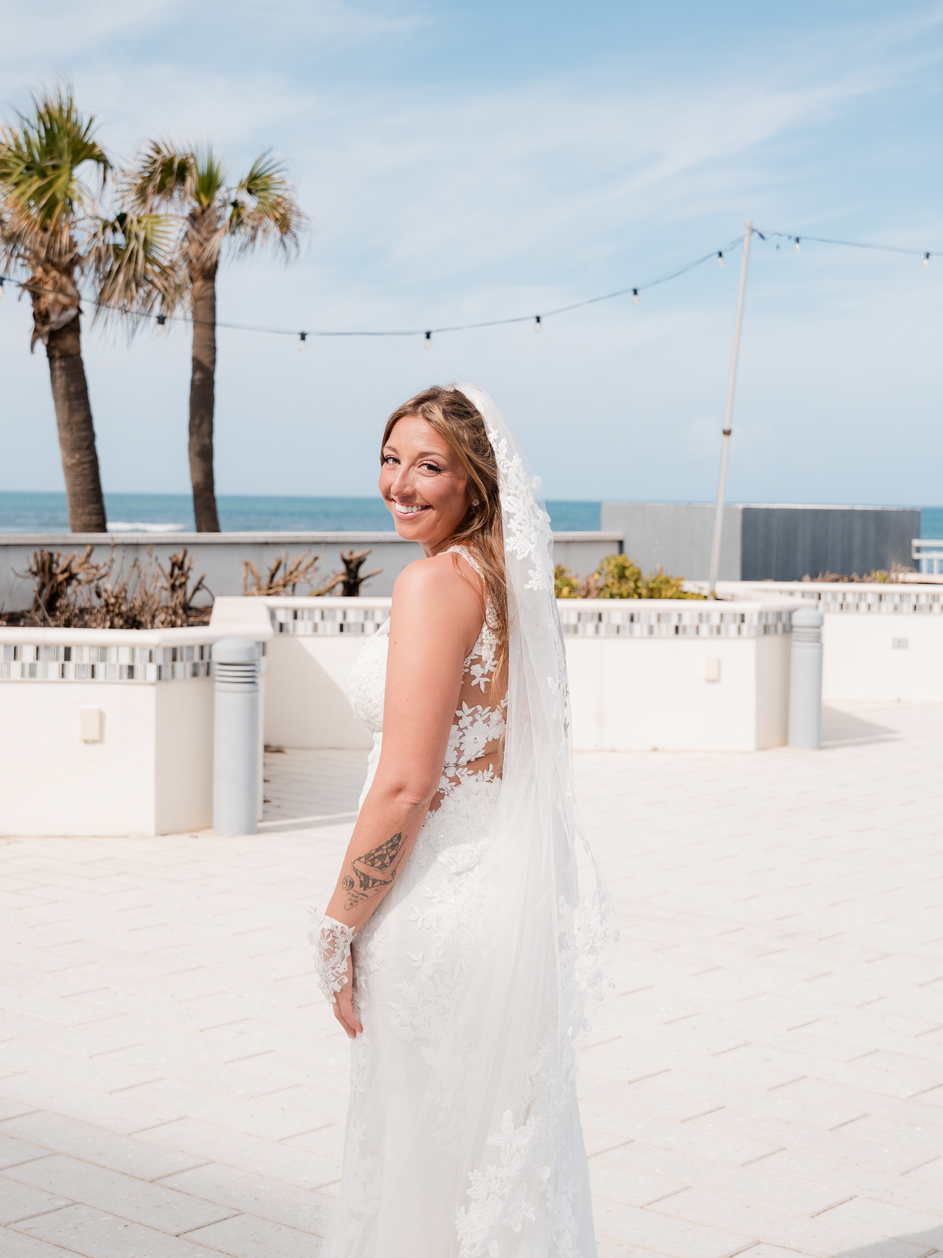 Bride portrait on the outdoor terrace at Hard Rock Hotel in Daytona Beach, FL.