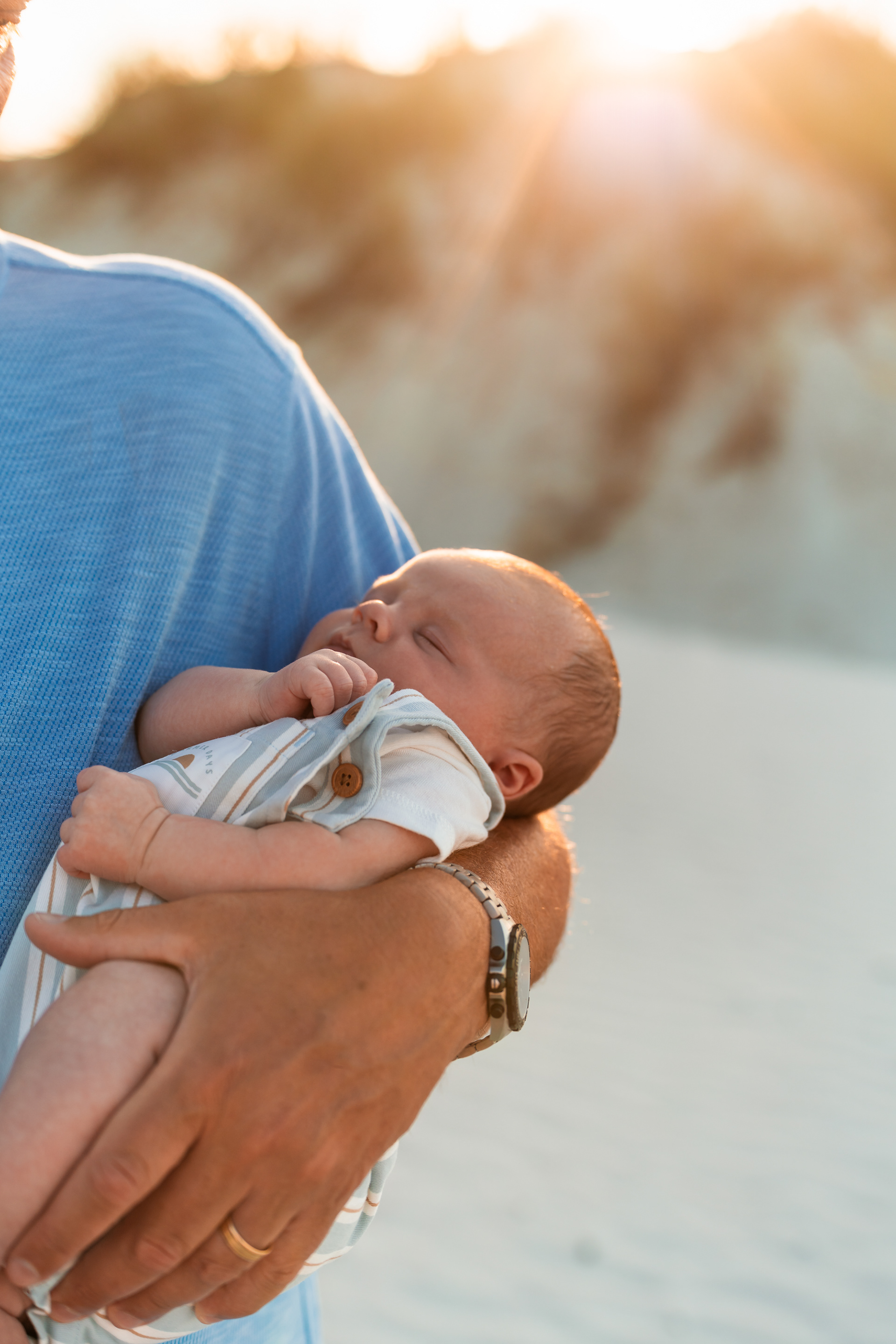 Close-up of a baby being held during a beach family photo session in Ponce Inlet.