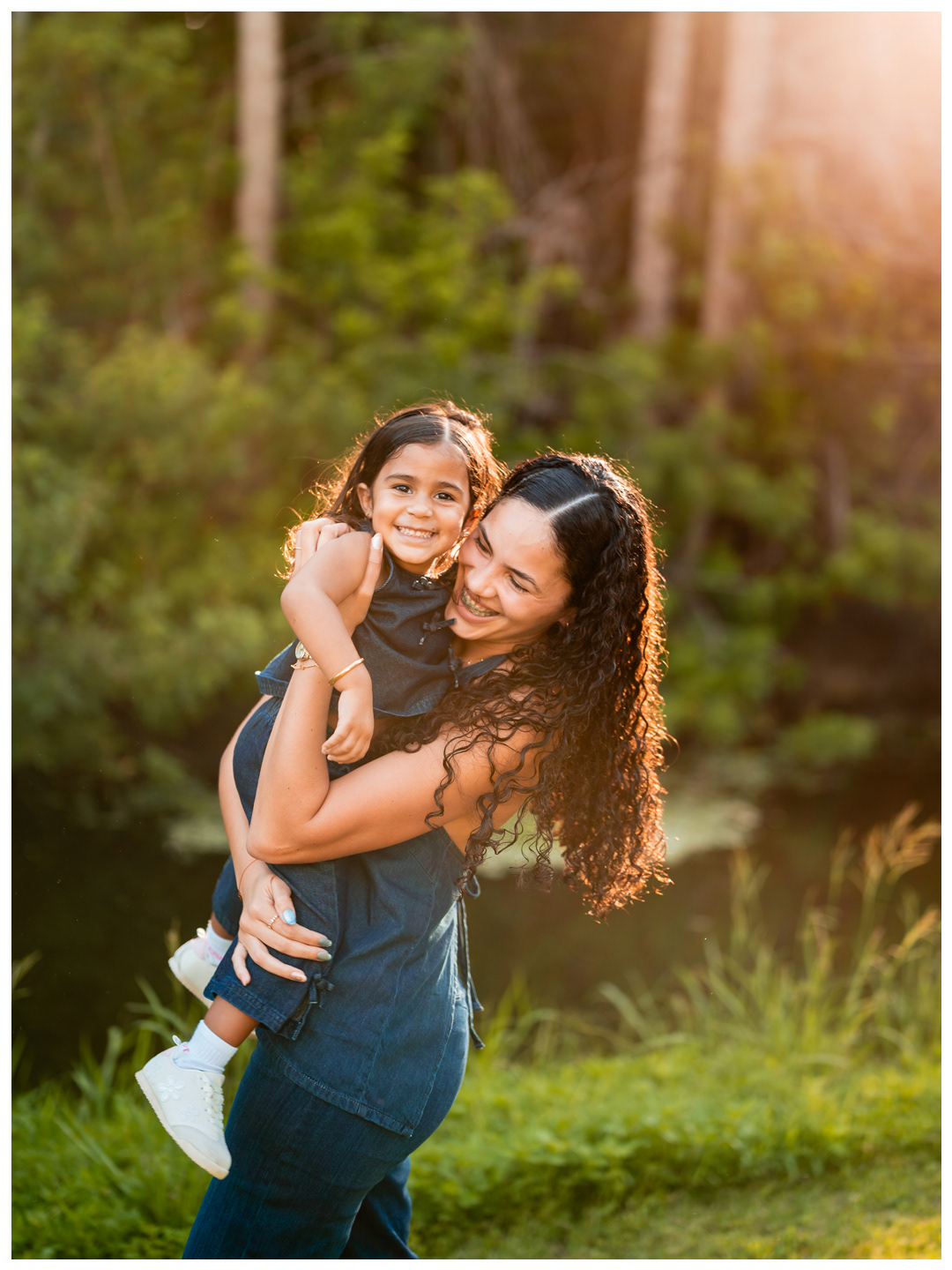 Candid mother and daughter photo in warm light at Buschman Park Florida