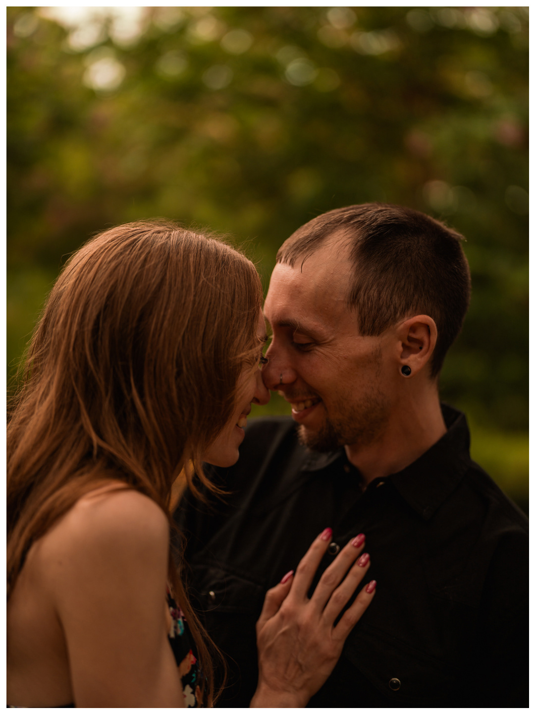 Close-up of a couple laughing together during a Washington Oaks Gardens couples session.